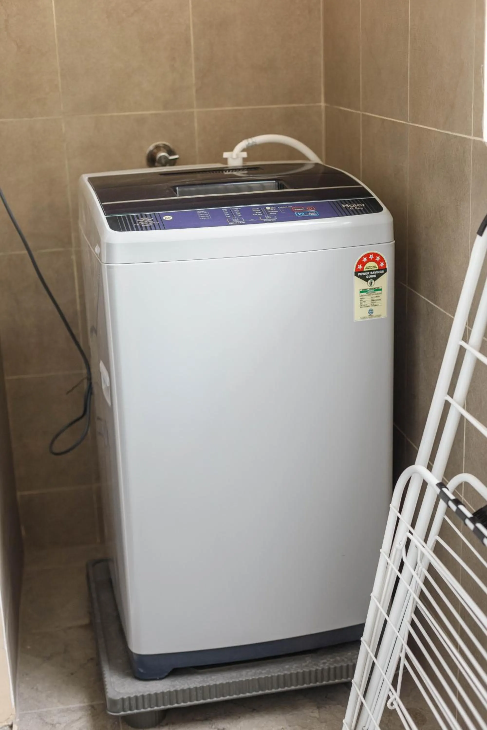 washing machine in Pinnacle Serviced Apartments