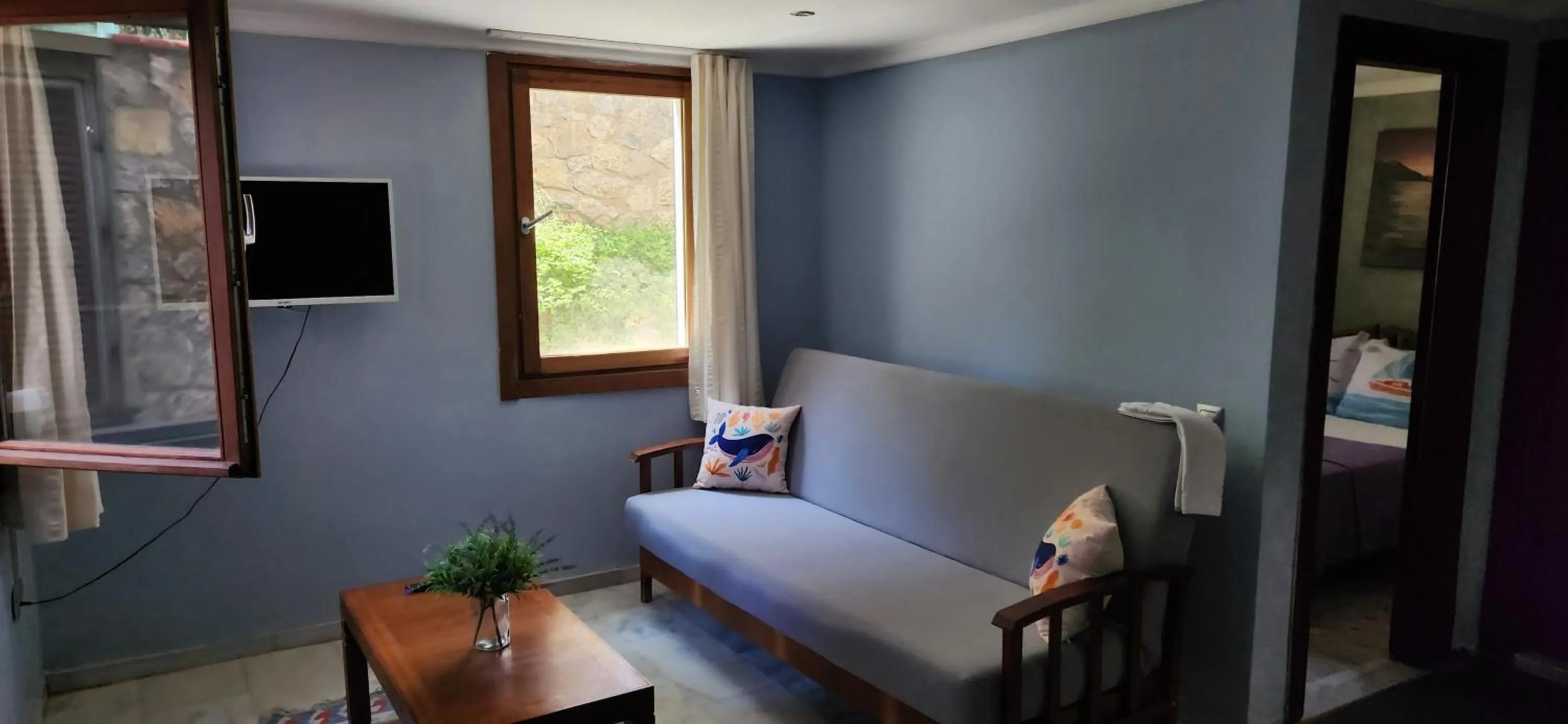 Living room, Bed in Stone House Hotel