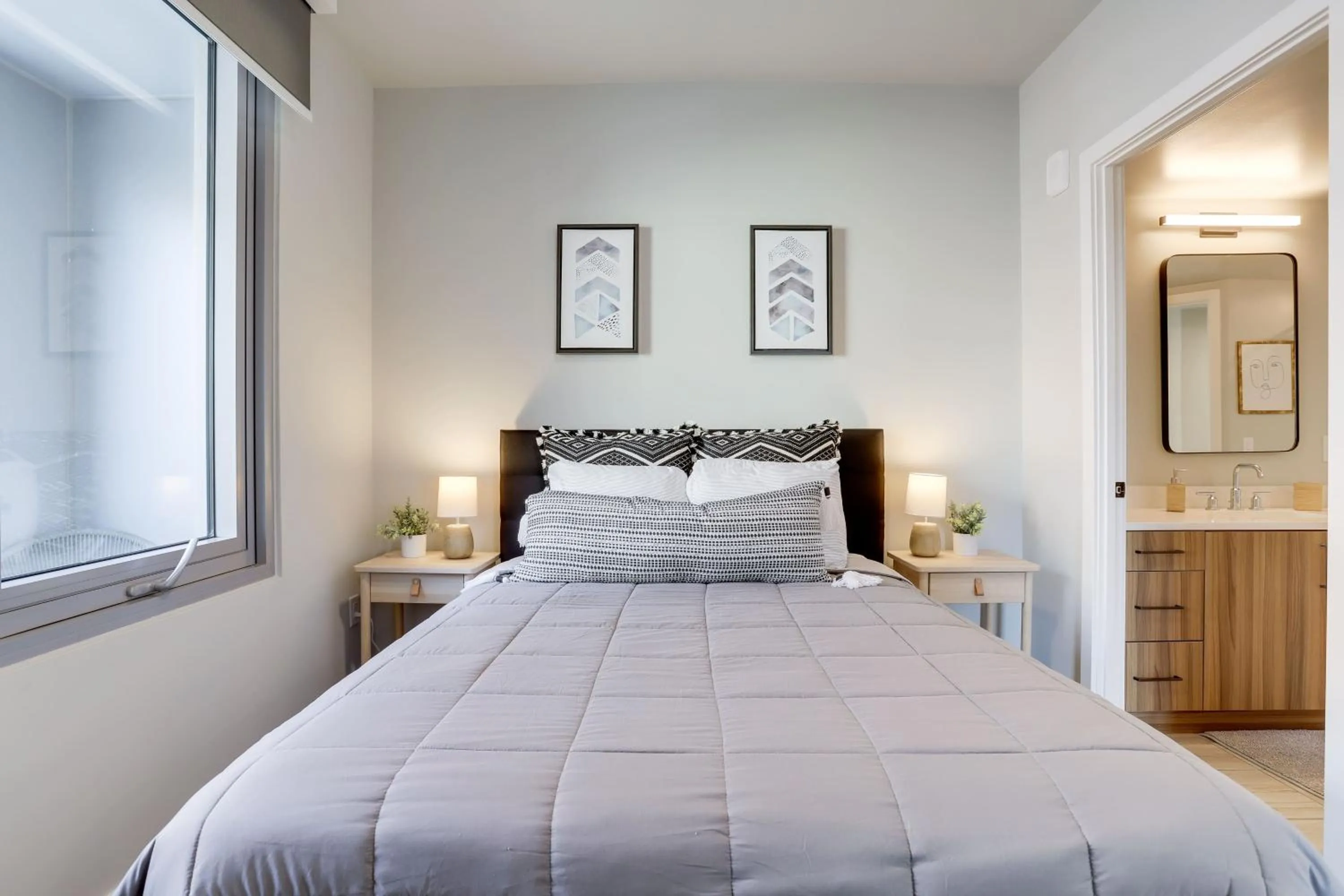 Bed in Stylish Condo at Clarendon with Rooftop Views