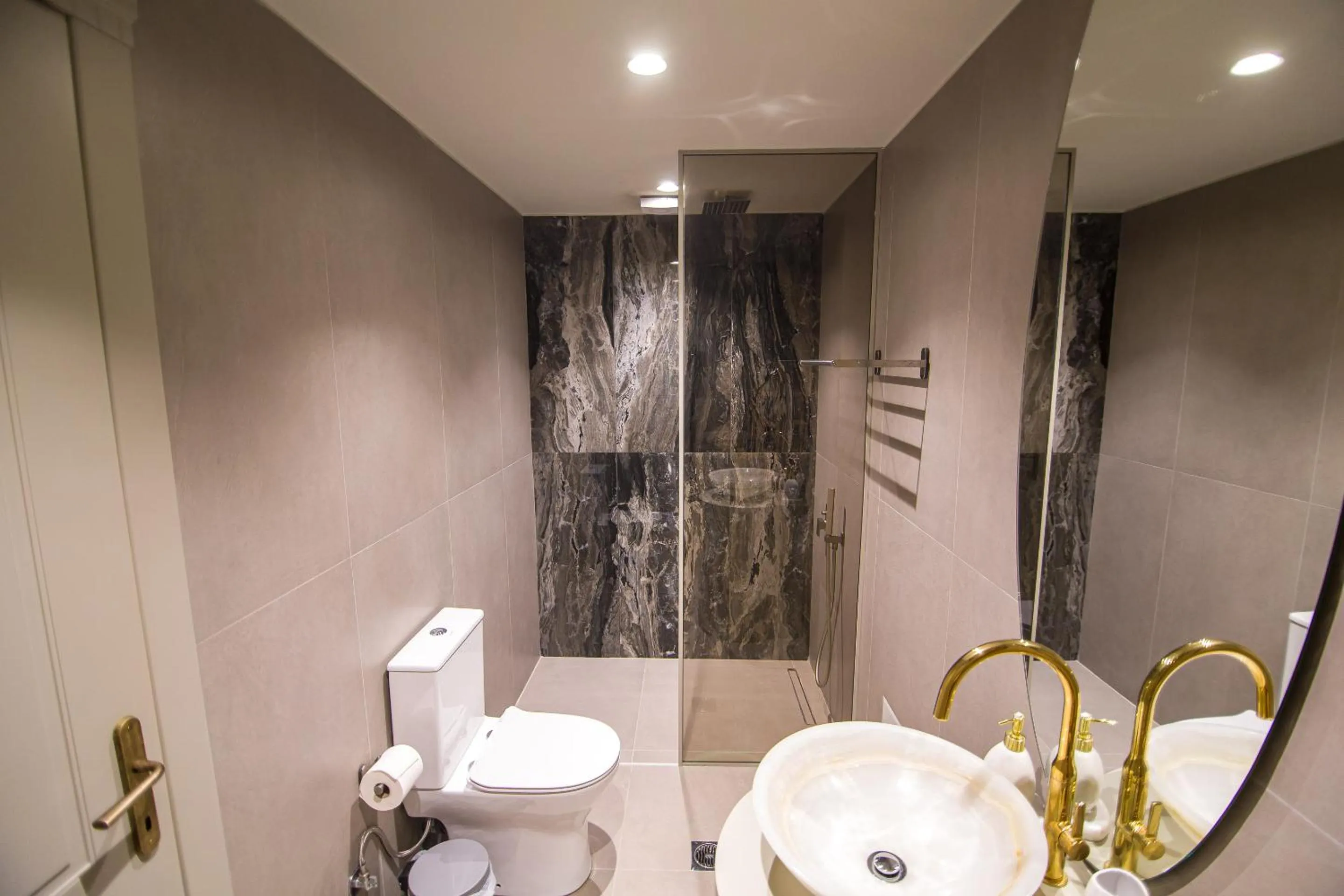 Shower in IO Luxury Pool & Hot Tub Suites