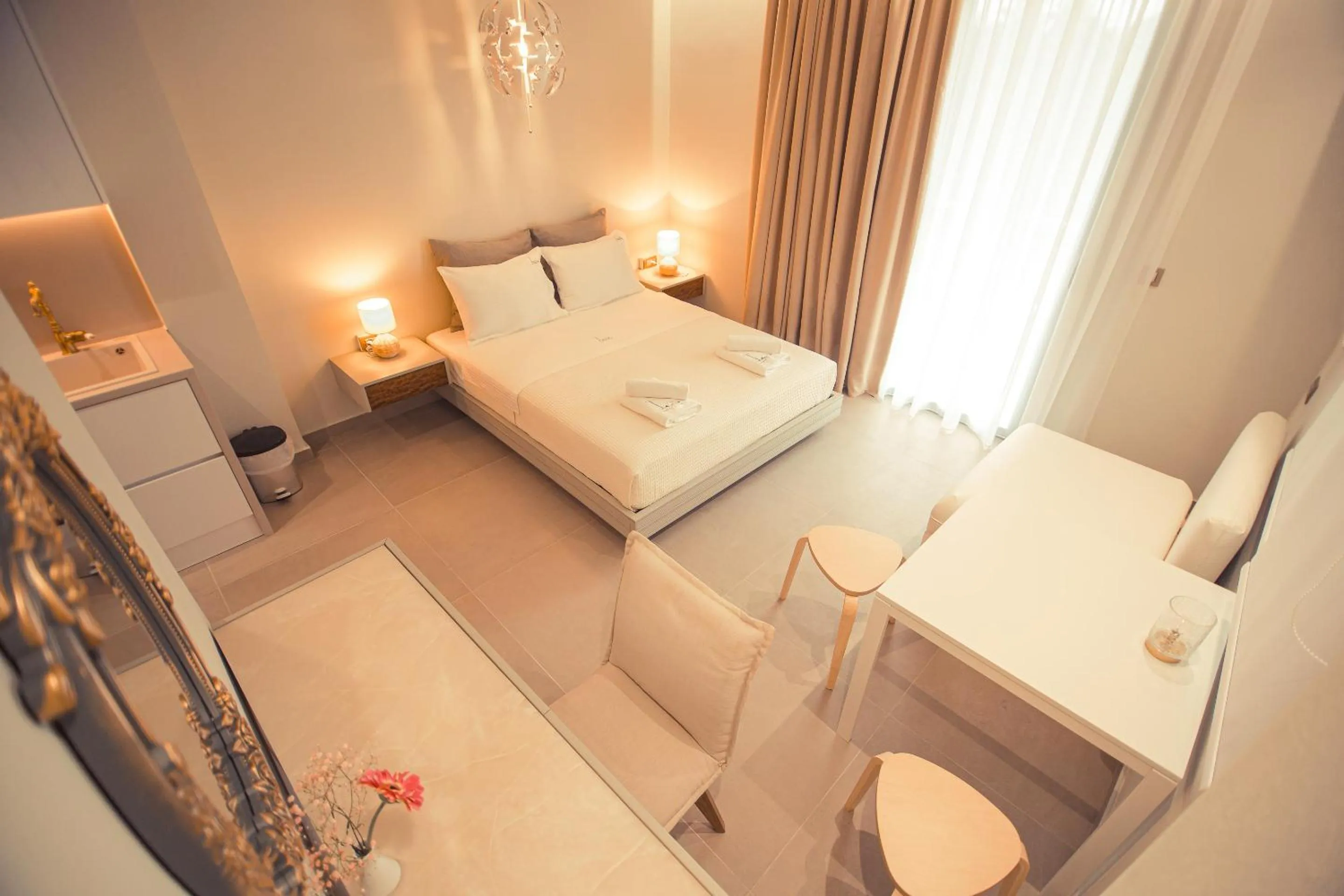 Bed in IO Luxury Pool & Hot Tub Suites