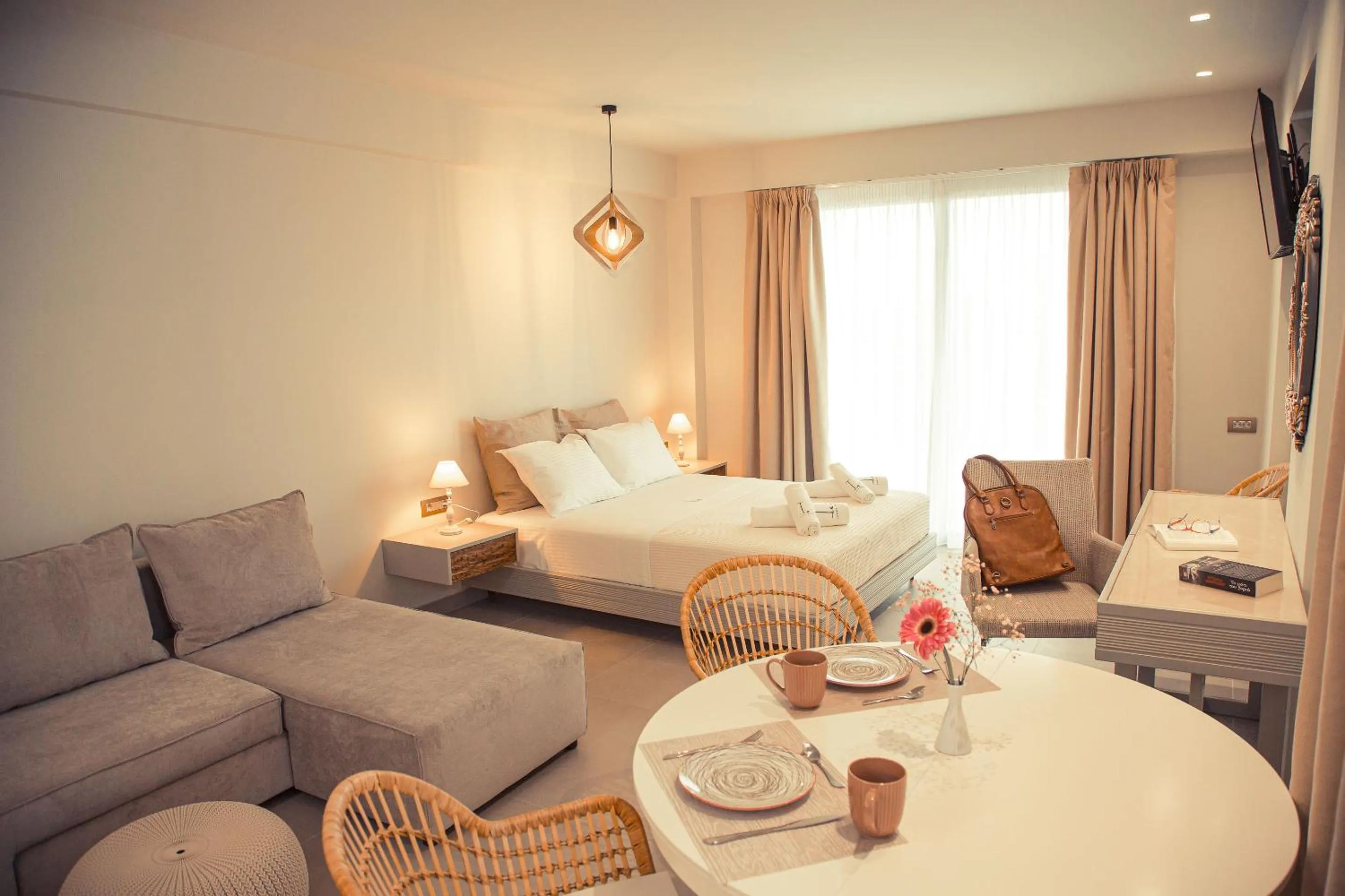 Bed in IO Luxury Pool & Hot Tub Suites