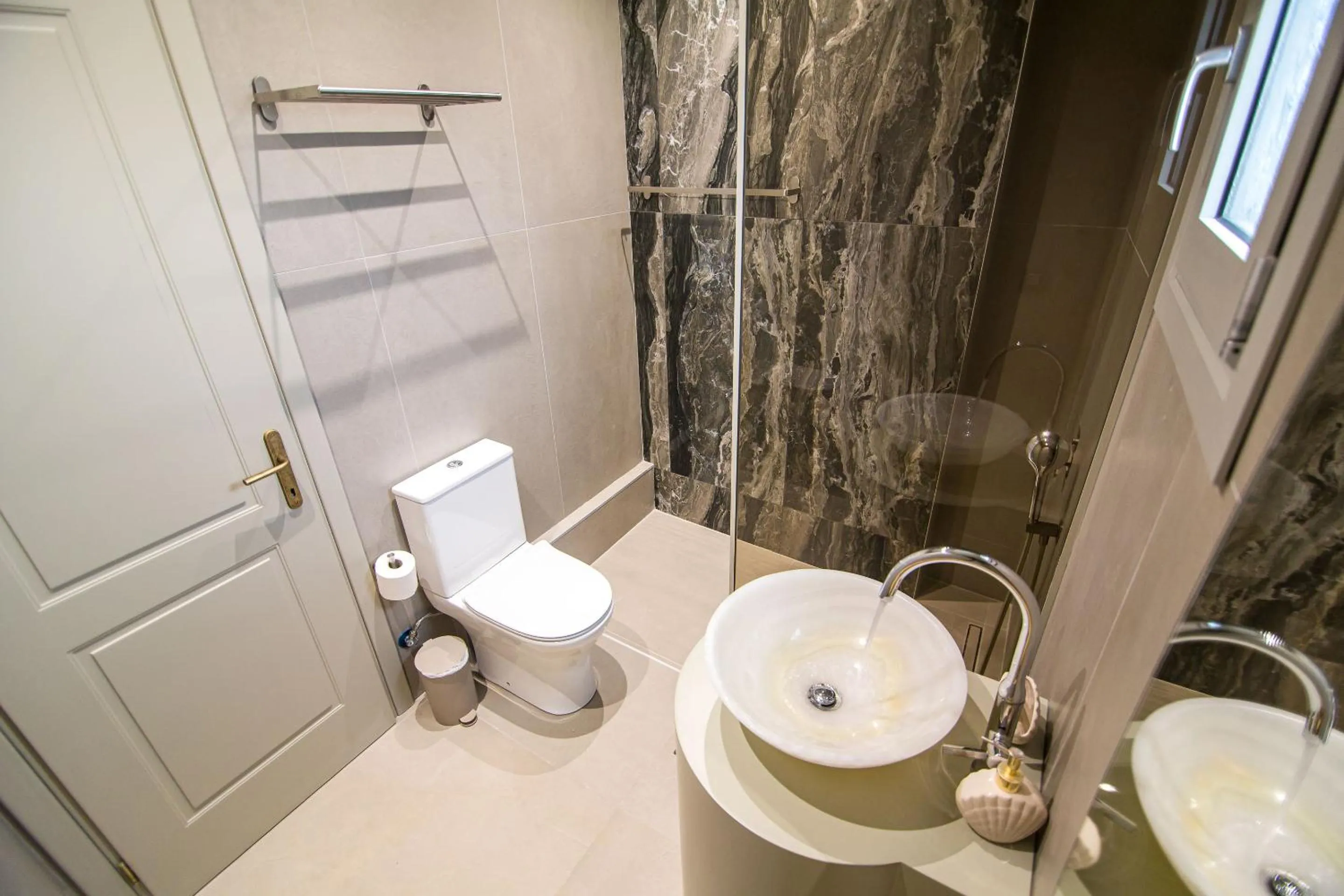 Shower in IO Luxury Pool & Hot Tub Suites