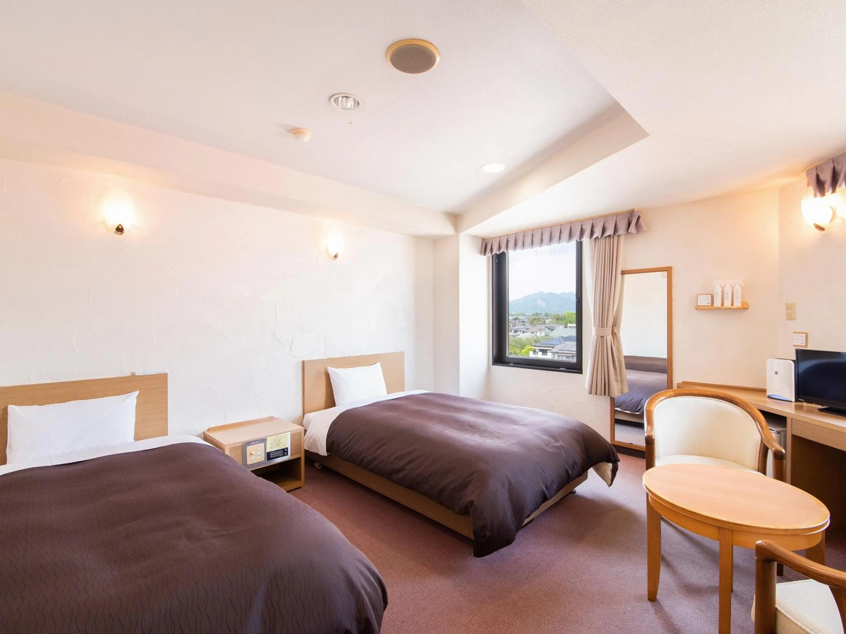 Photo of the whole room, Bed in Hotel Primrose Saito