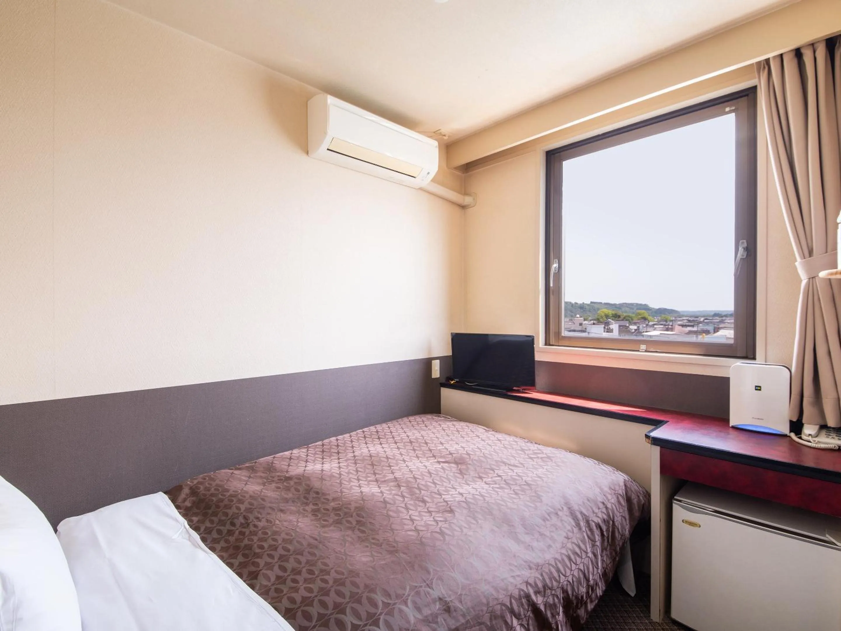 Photo of the whole room, Bed in Hotel Primrose Saito