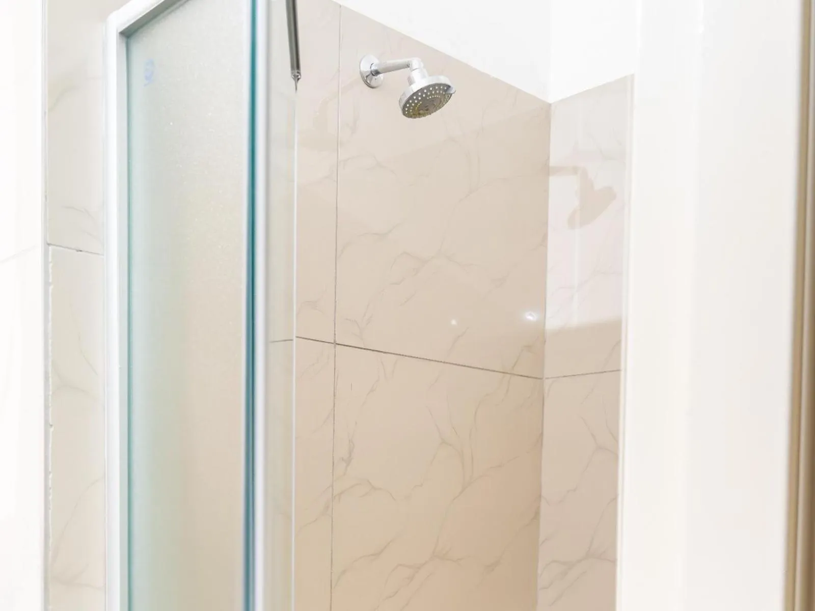 Shower in Ngwenya City Hotel