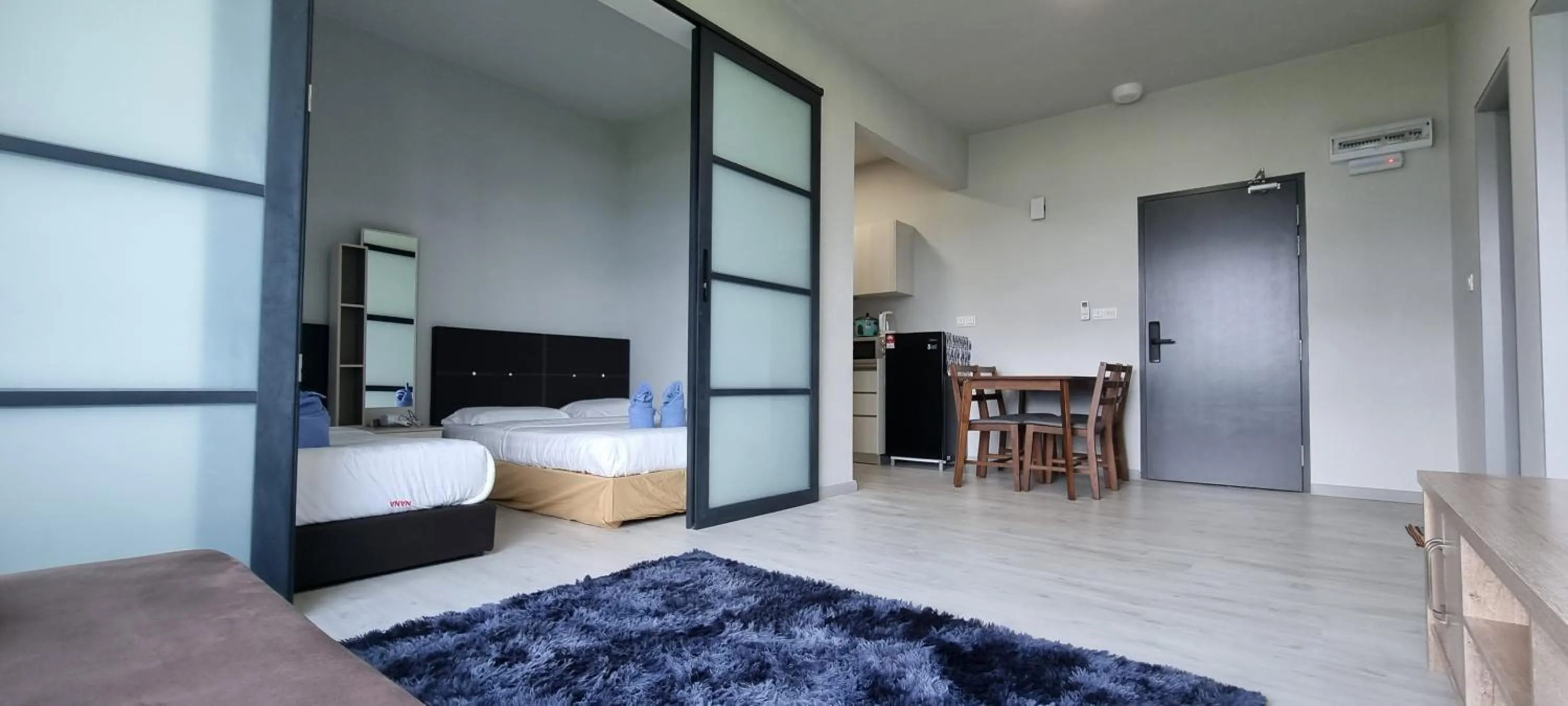 Photo of the whole room, Bed in Nana Homestay - Jesselton quay