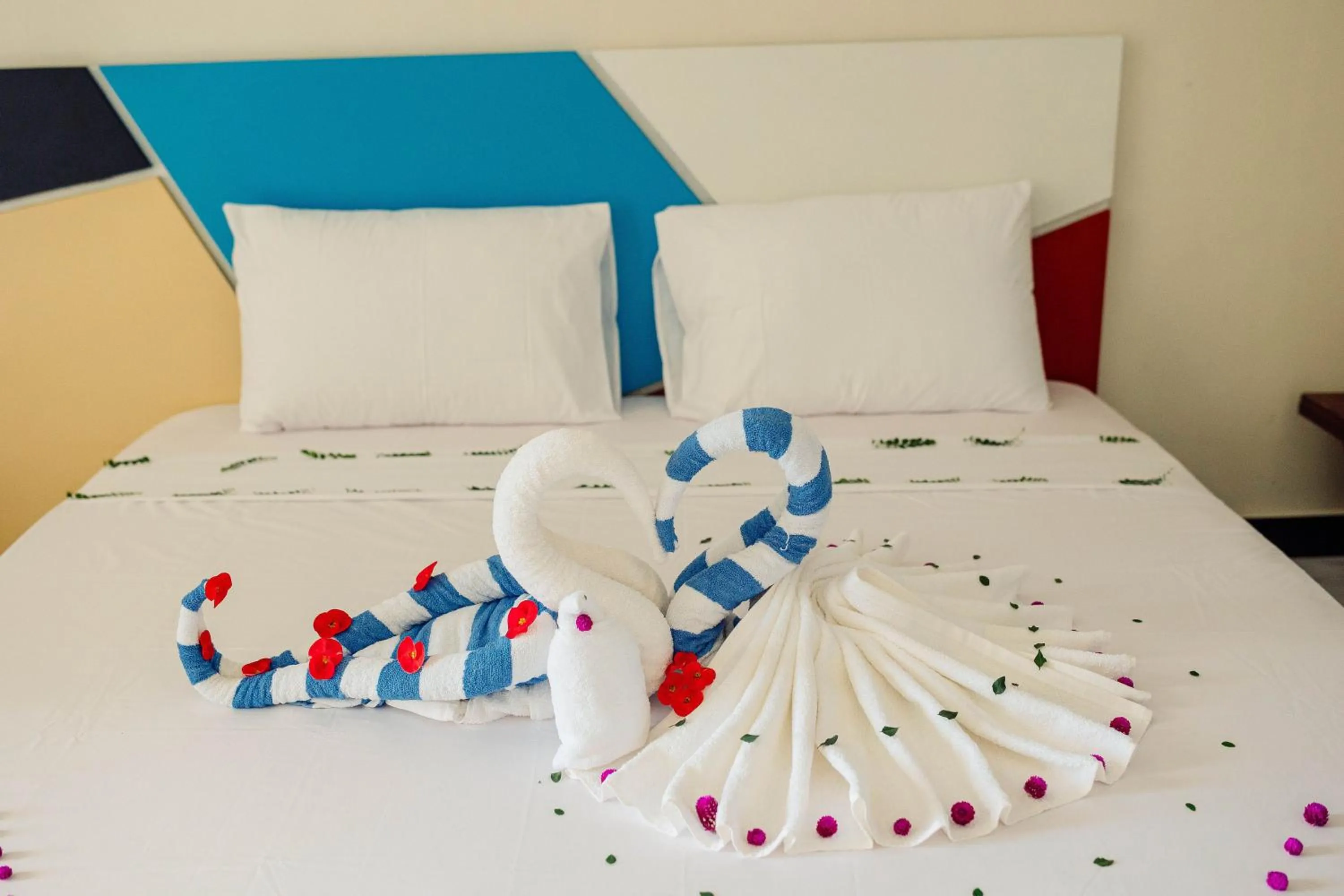 Bed in Ocean Breeze Hotel