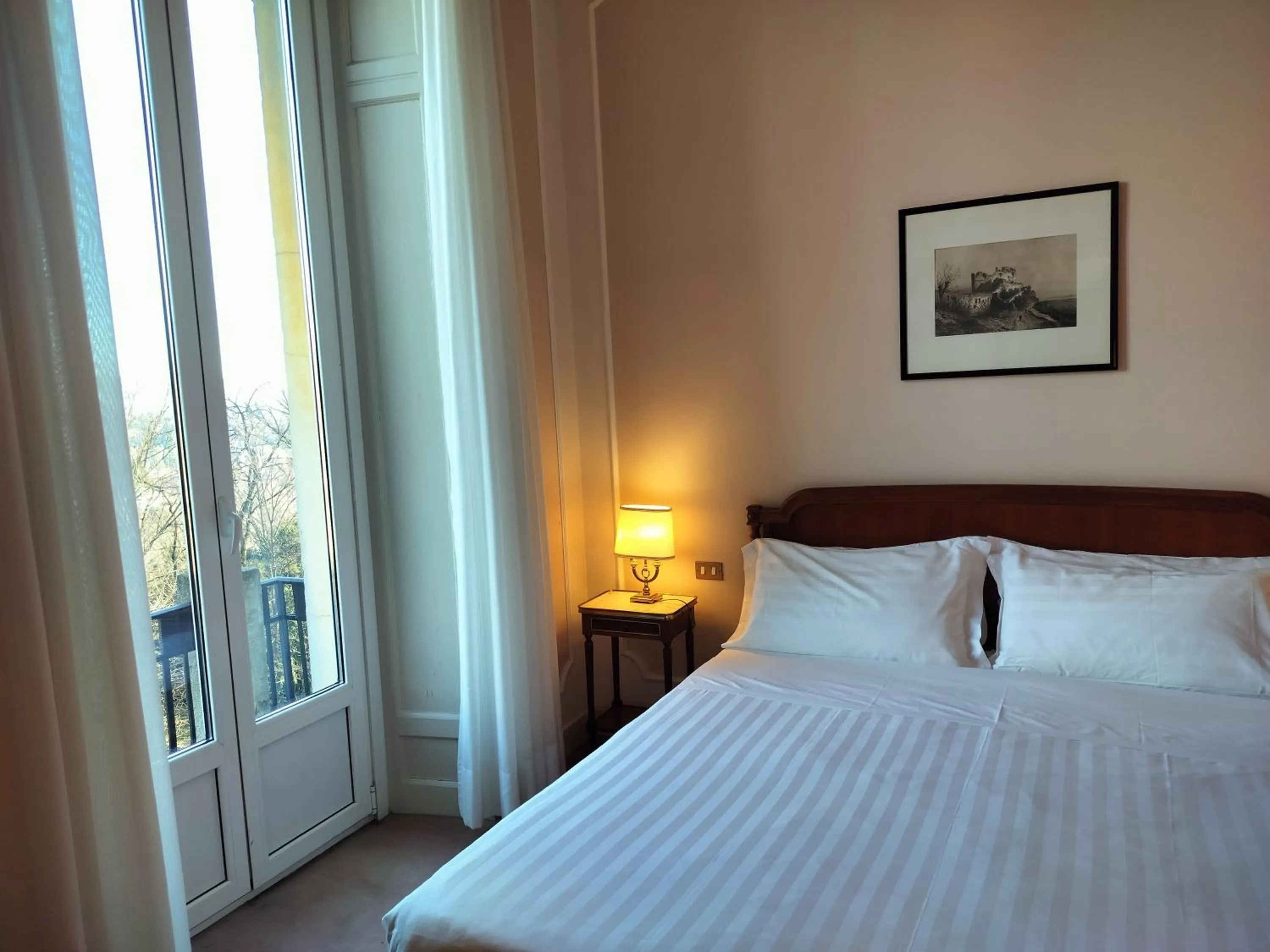 Bed in Palace Grand Hotel Varese