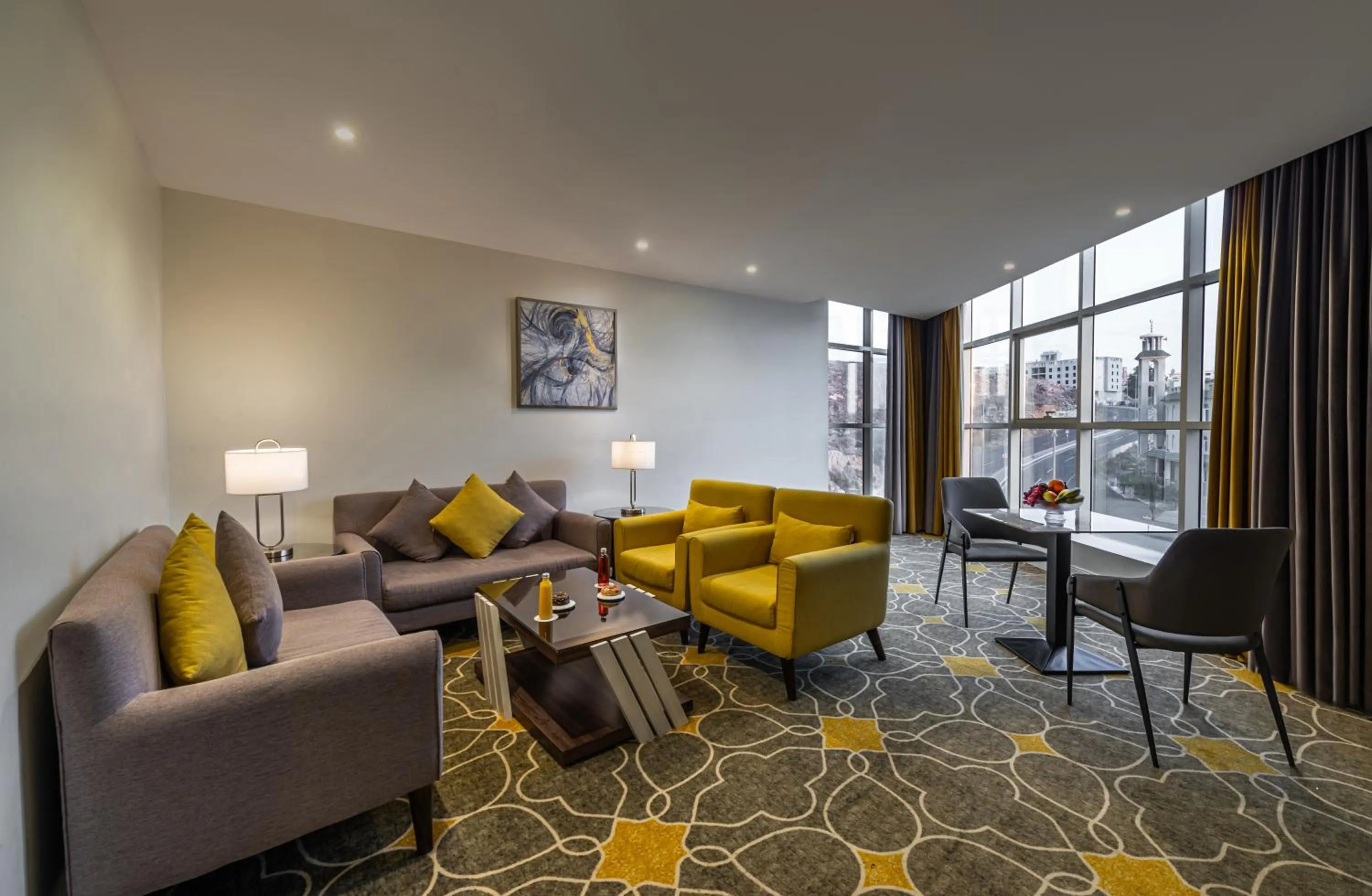 Communal lounge/ TV room in Abha Gardn Millennium Hotel