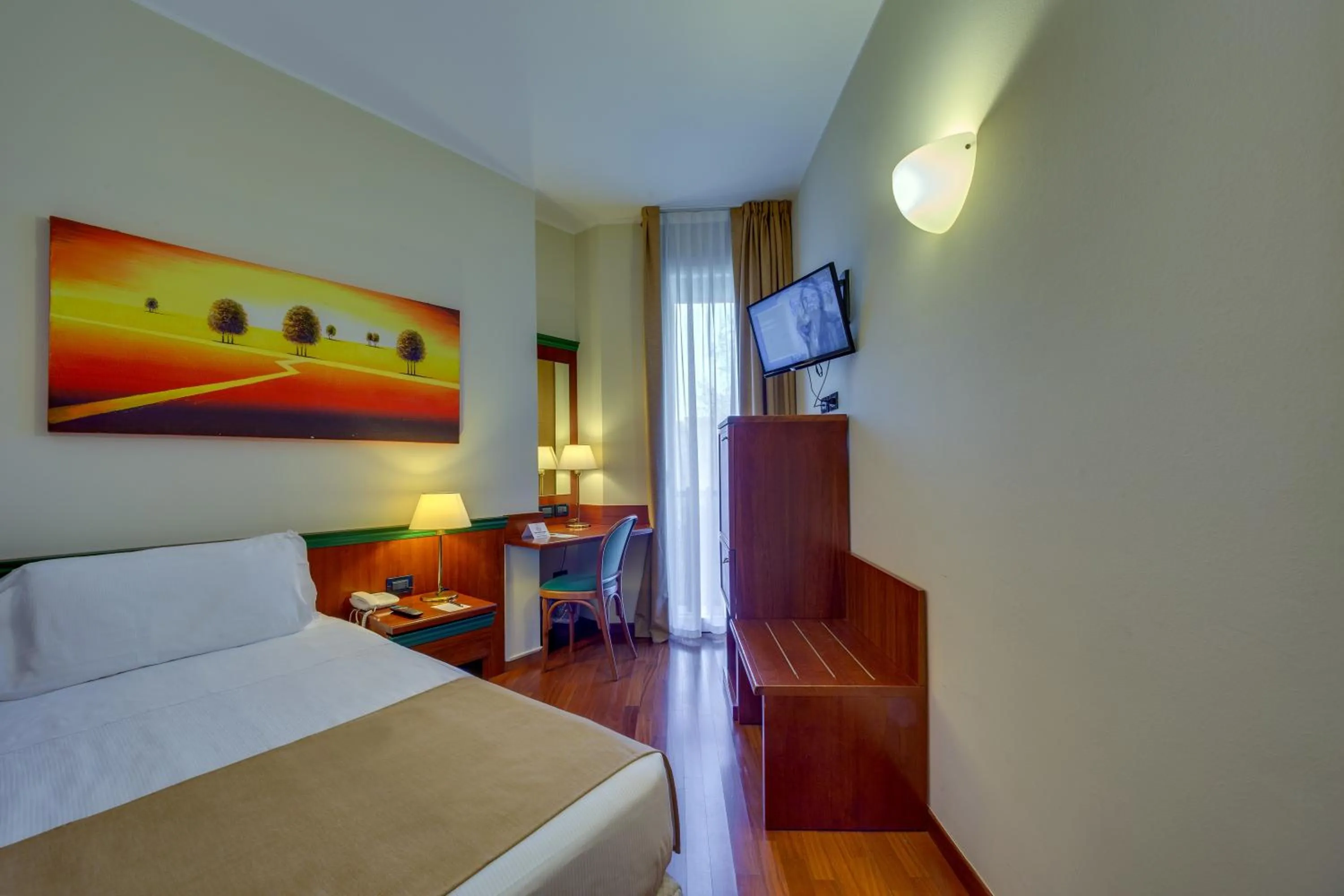 Bed in Hotel Raffaello