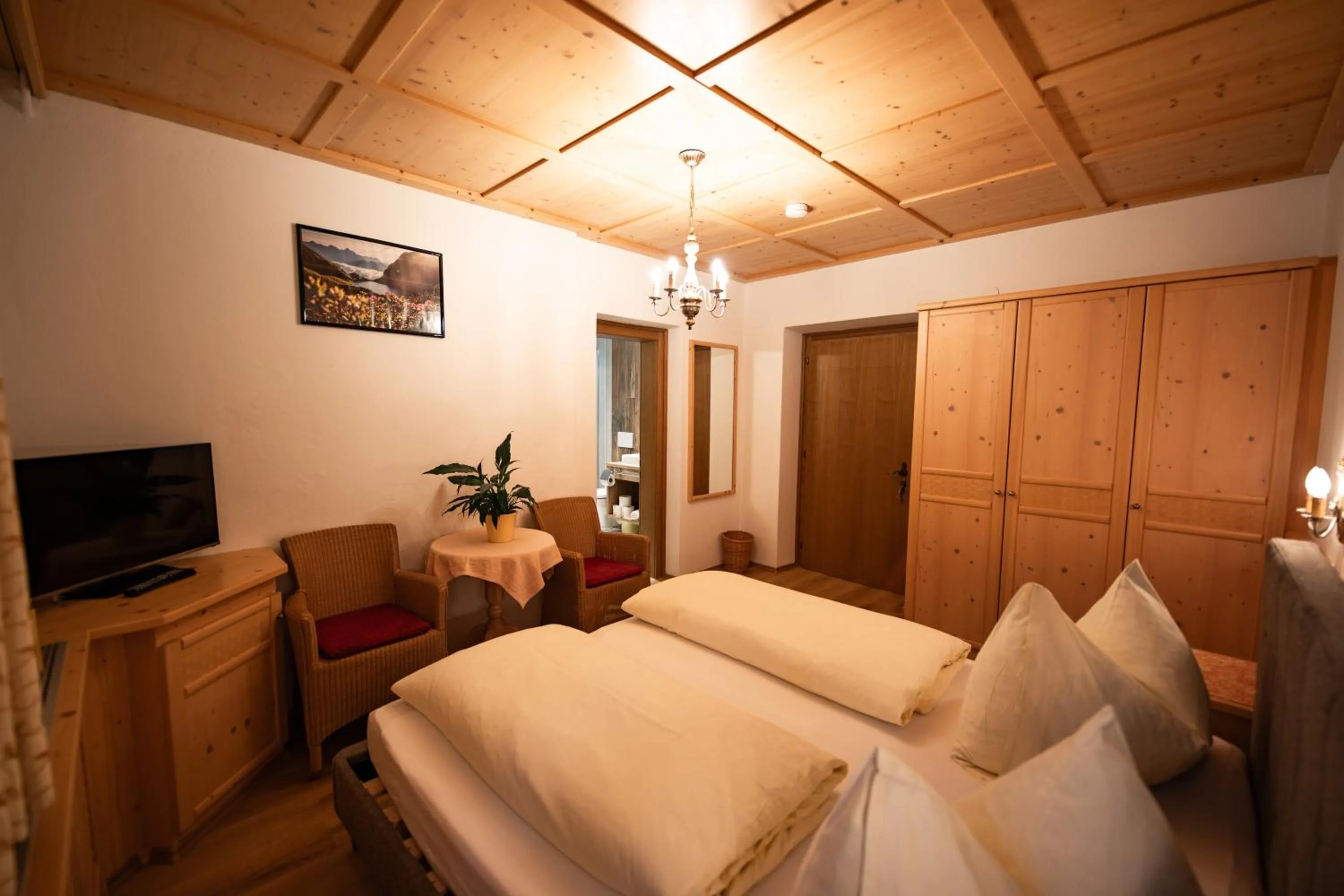 Bed in Dandler - Zimmer und Ferienwohnungen