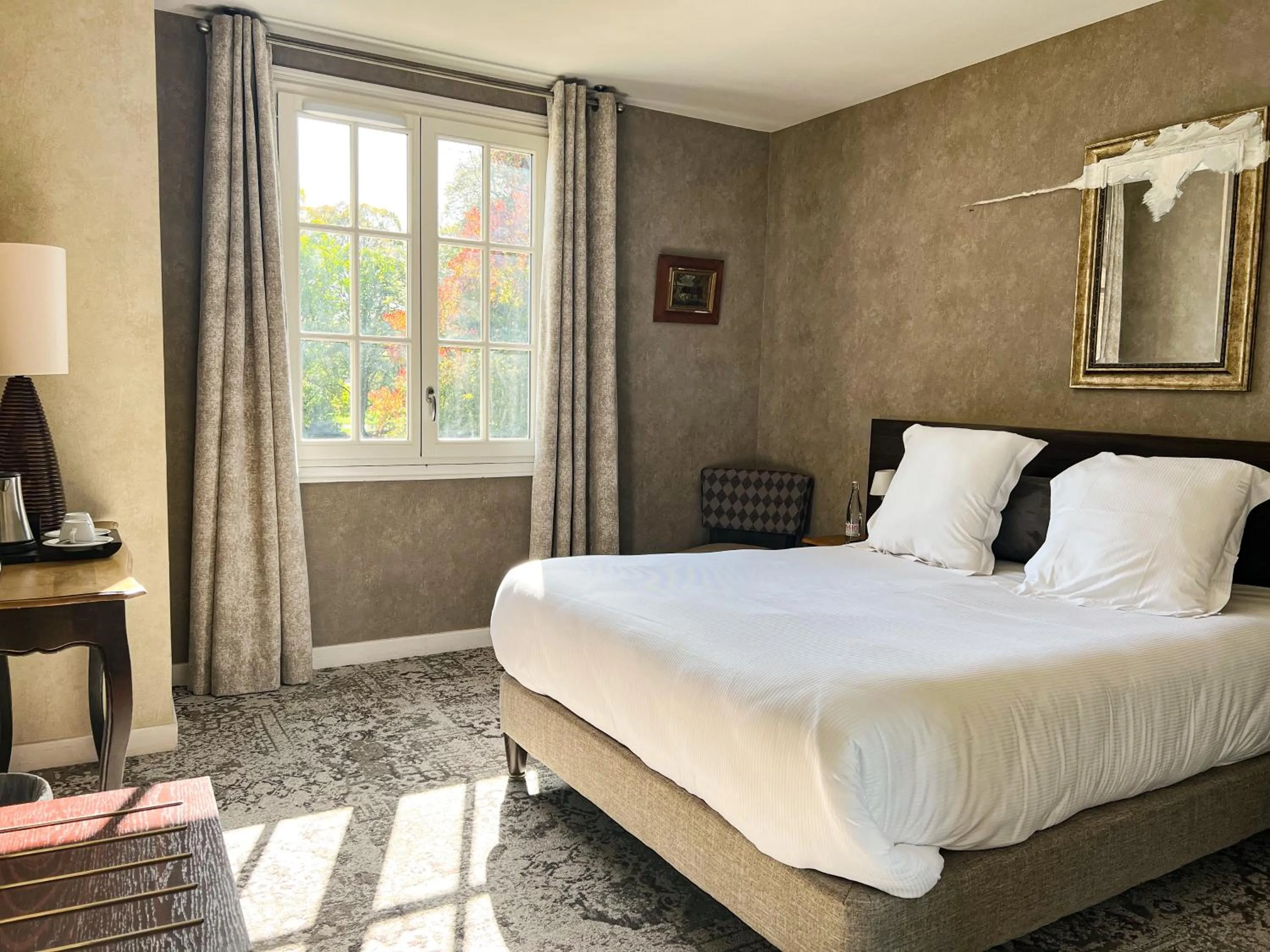 Bed in Logis Hôtels Château de La Barge