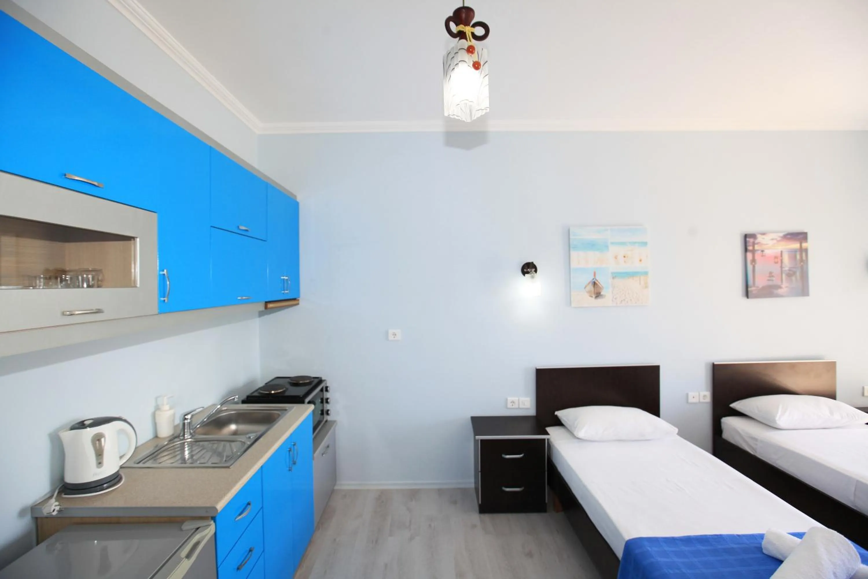 Kitchen or kitchenette, Bed in Keos Hotel