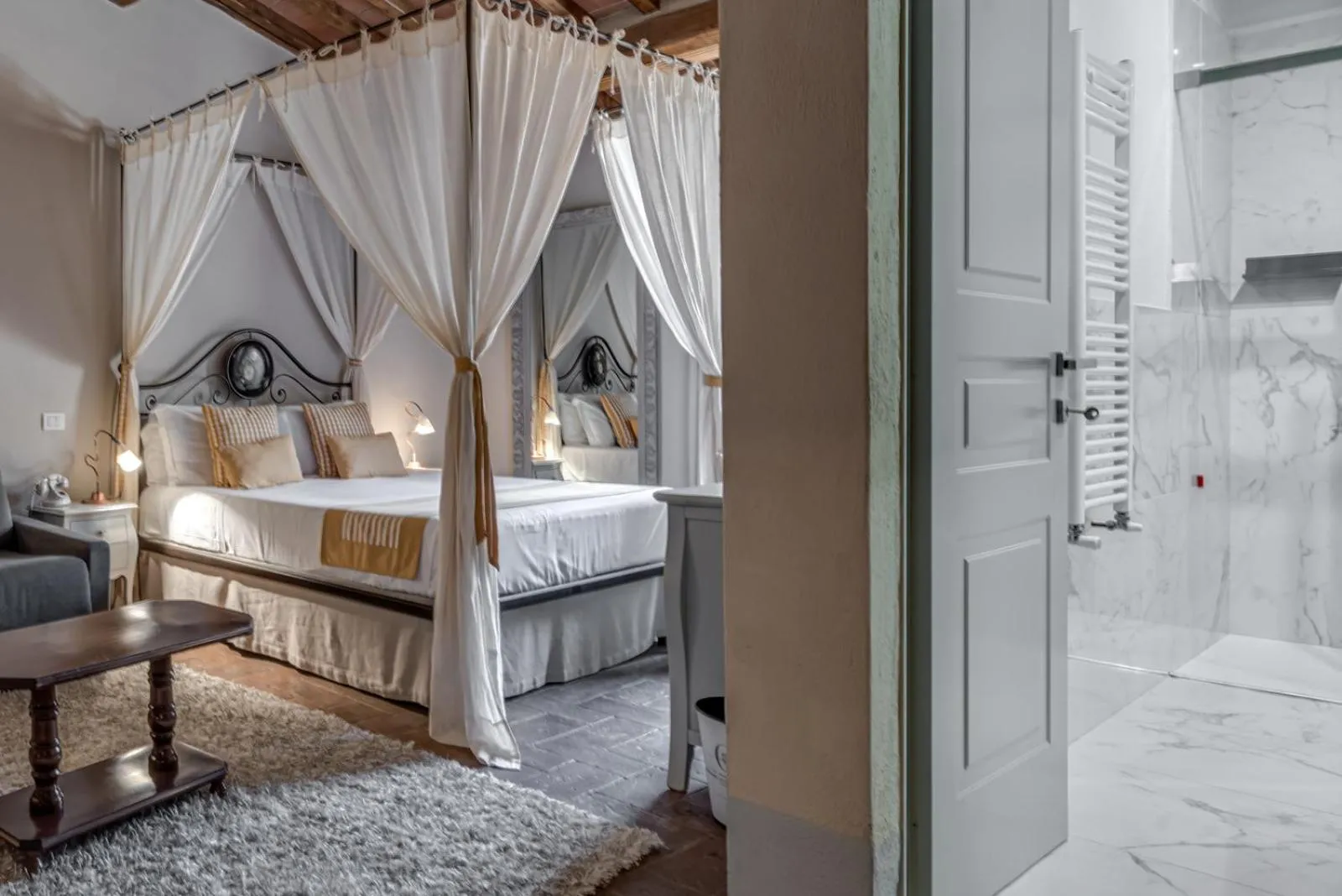 Bathroom, Bed in PALAZZO DEL CAPITANO Wellness & Relais - Luxury Borgo Capitano Collection