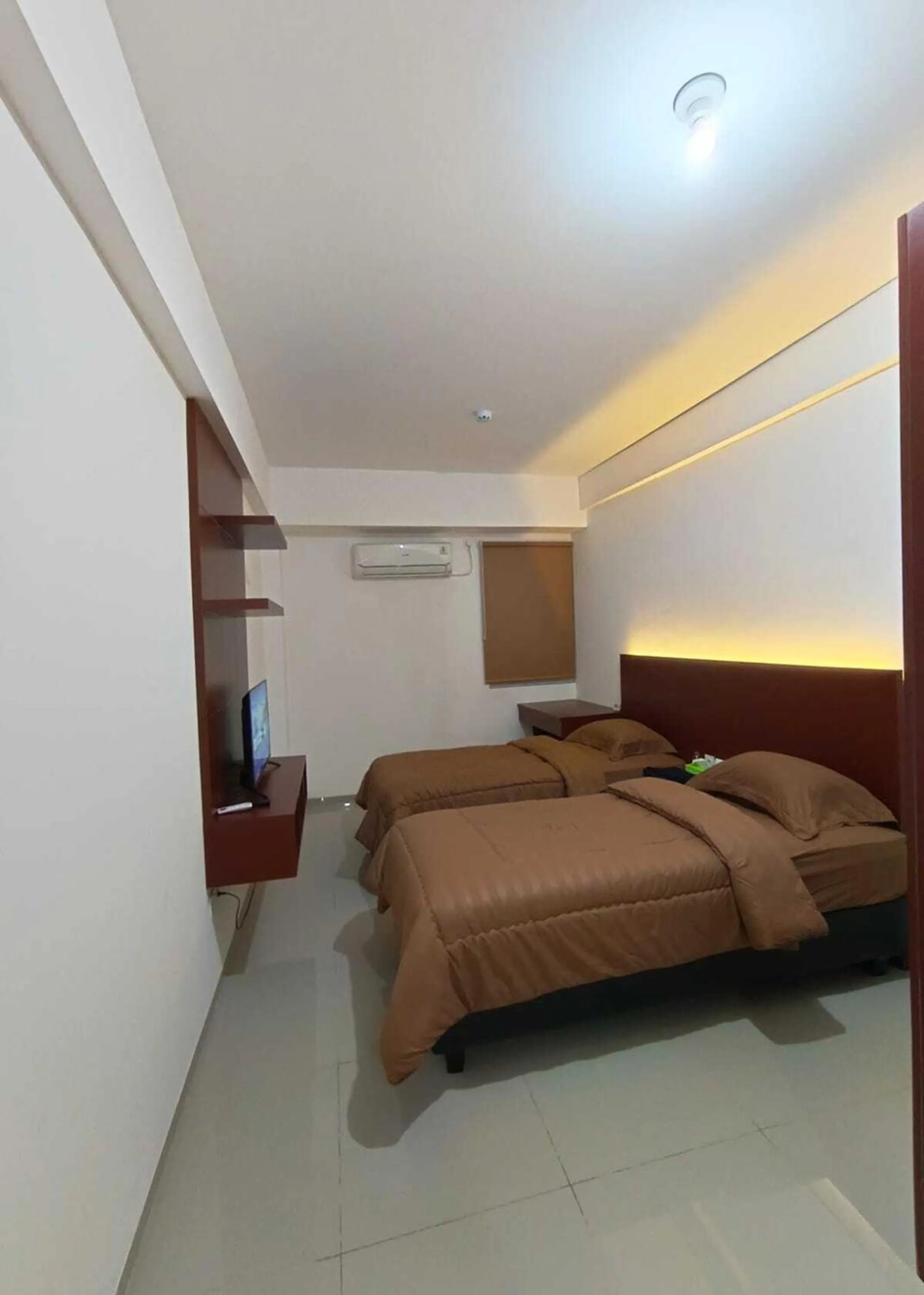 Bed in Hariss Inn Bandara
