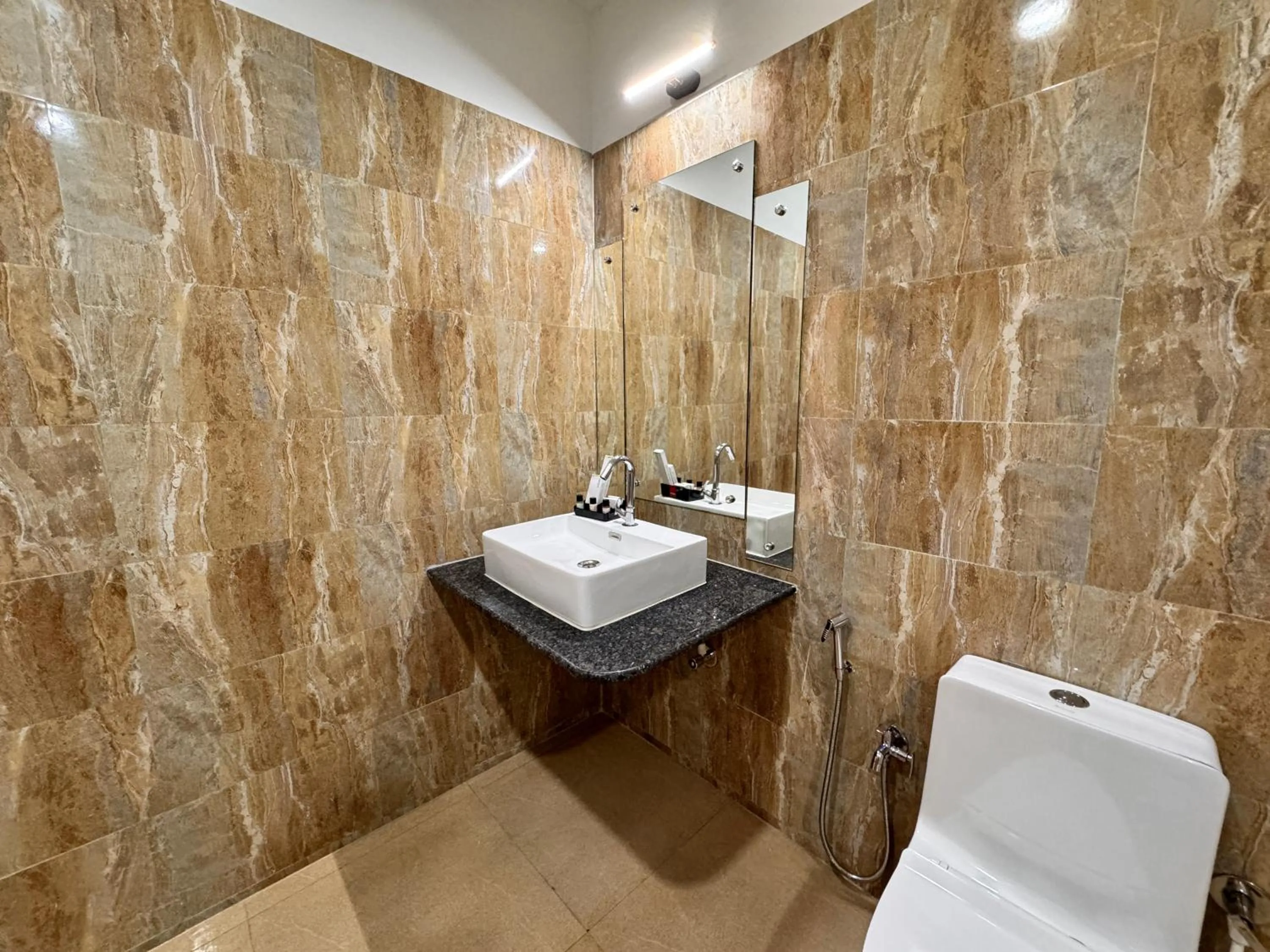 Toilet in Lemon Grass Resort & Spa