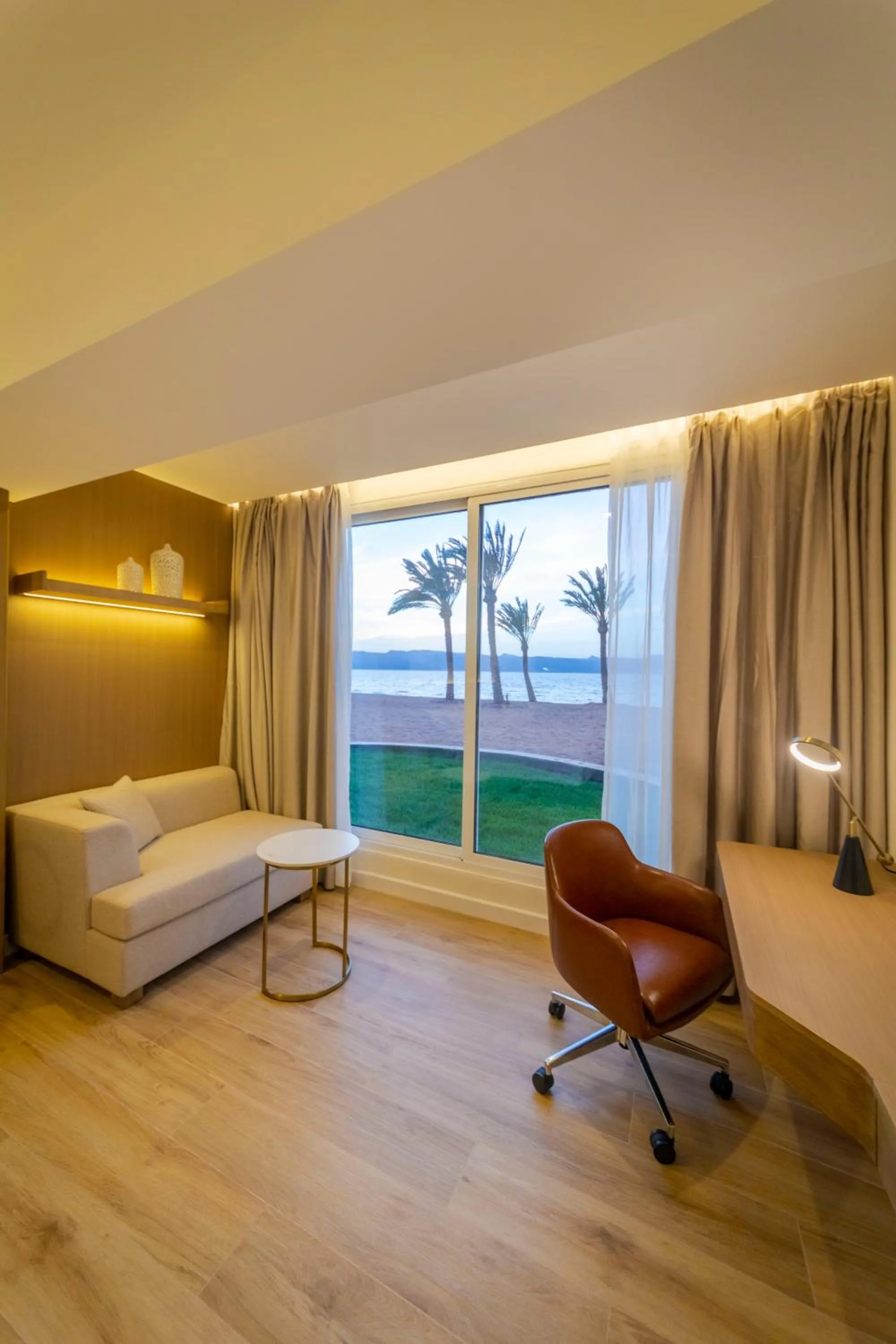 Seating area, Bed in Luxotel Aqaba Beach Resort & Spa Only 15 years plus