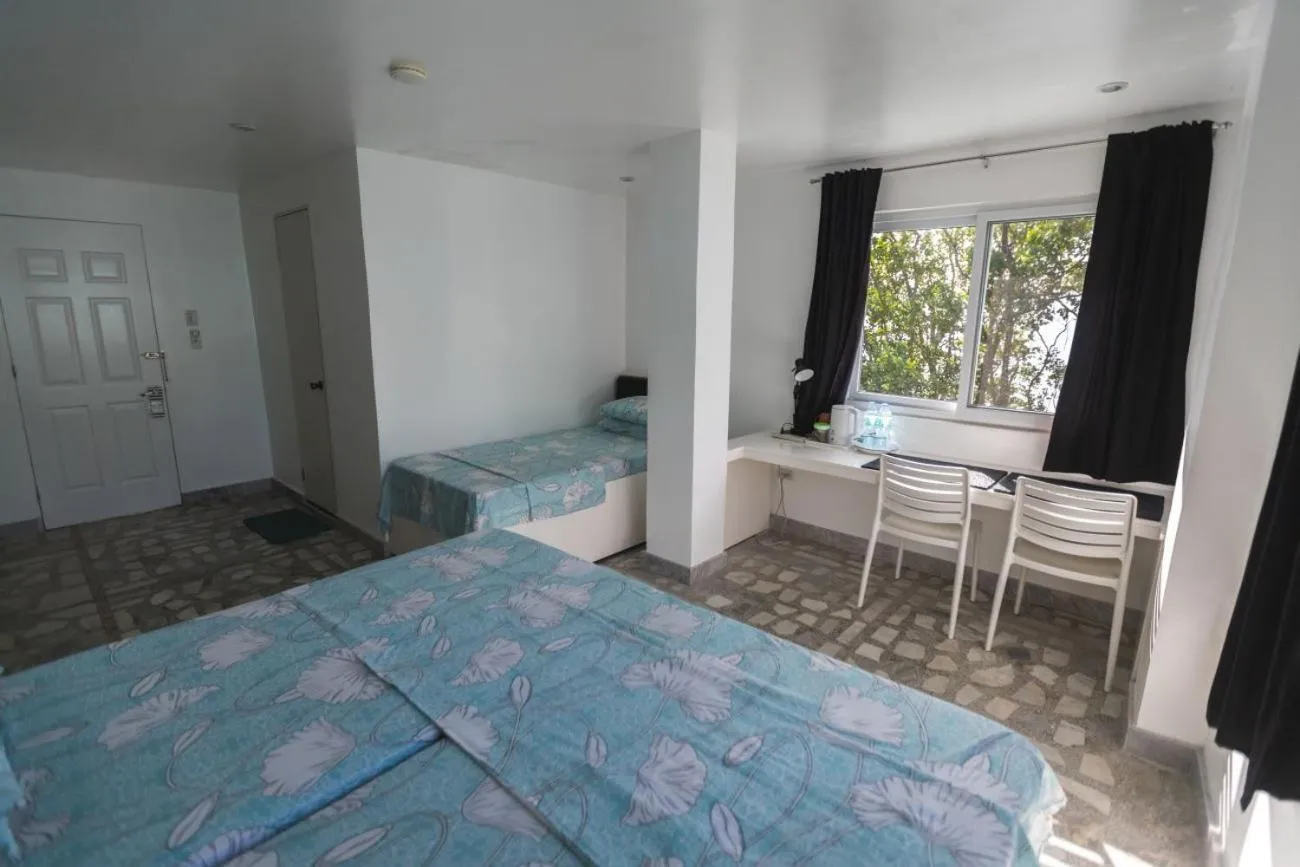 Bed in The Three P Beach Resort & Dive Center