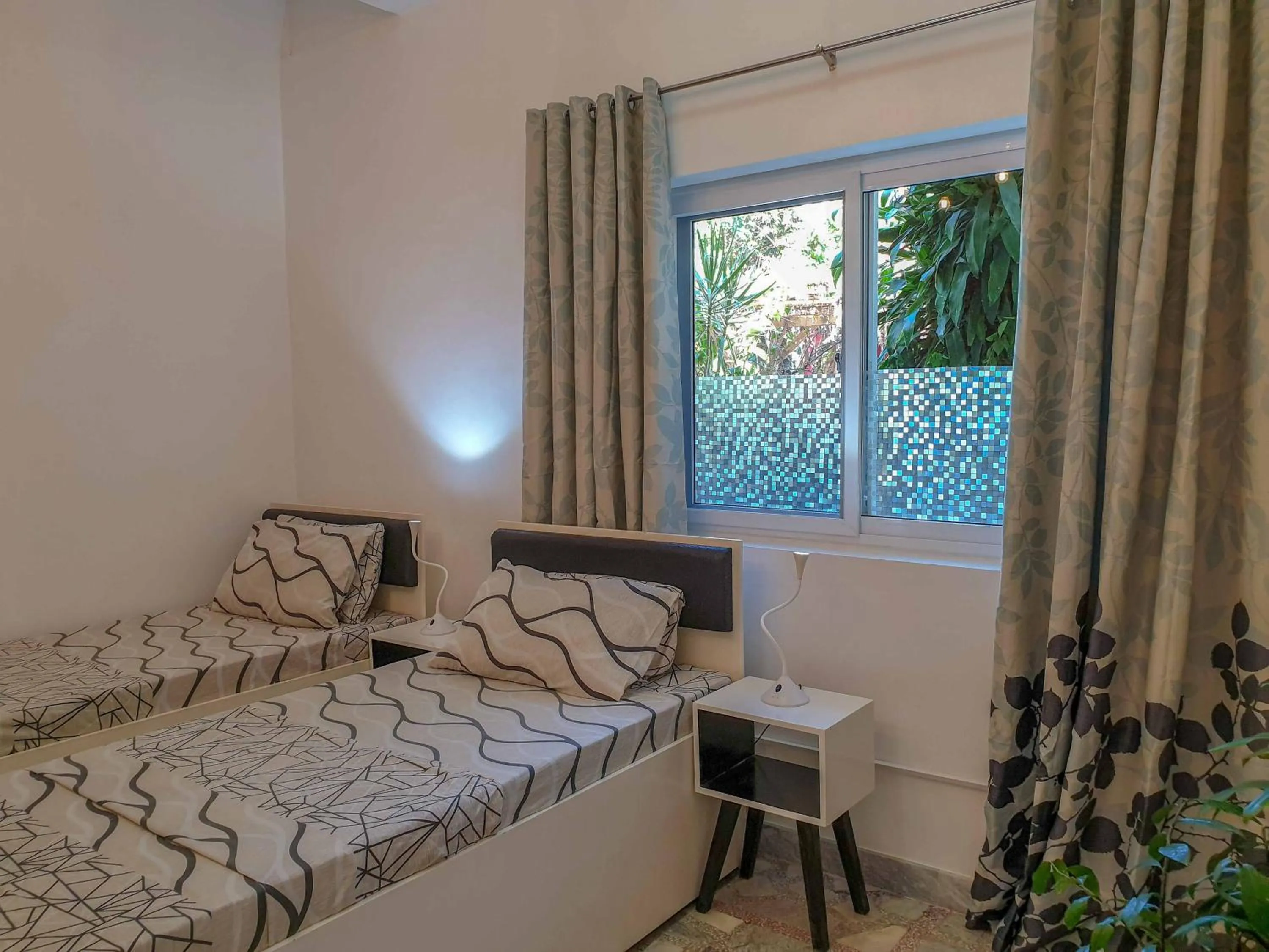 Bed in The Three P Beach Resort & Dive Center