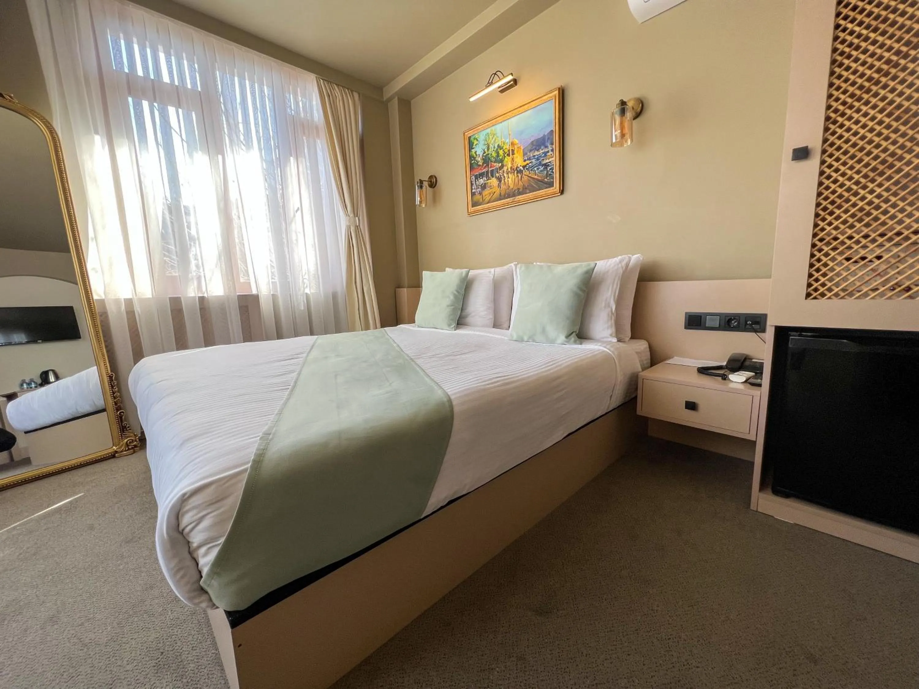 Bed in By Kinyas Hotel