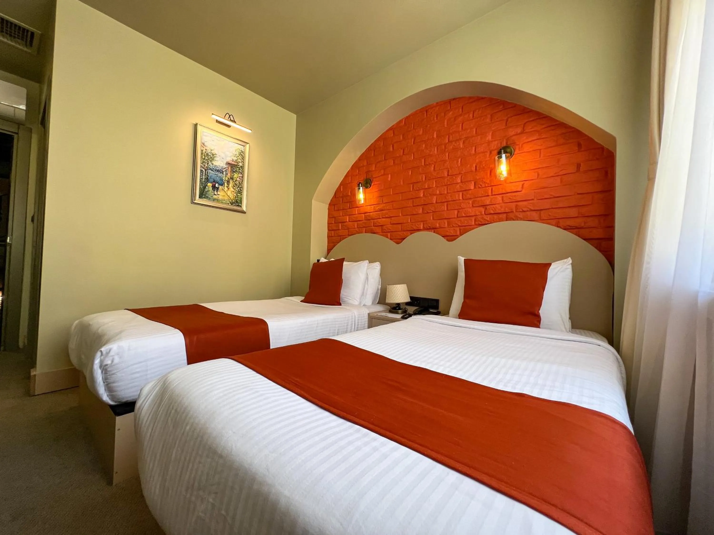 Bed in By Kinyas Hotel