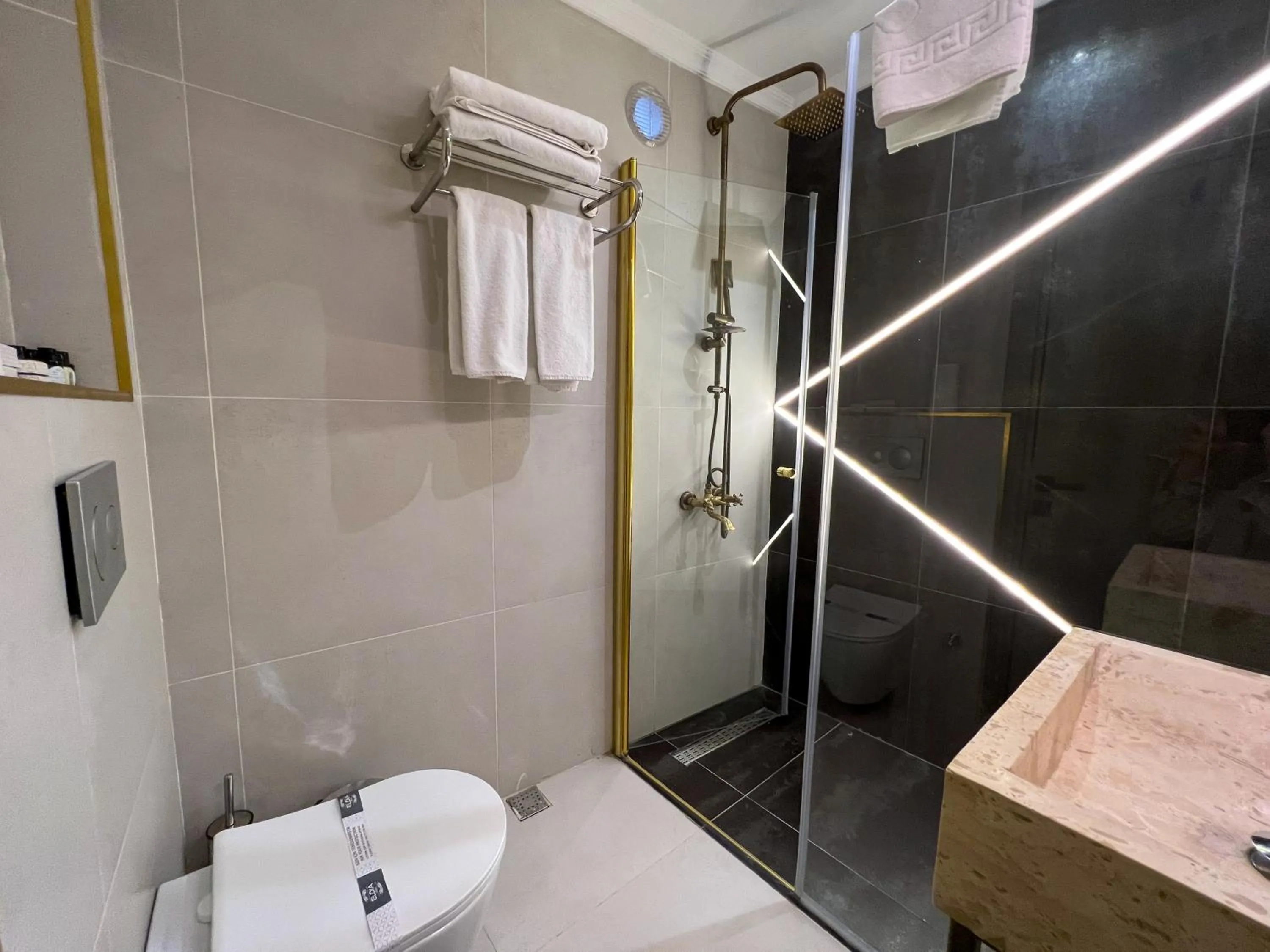 Shower in By Kinyas Hotel