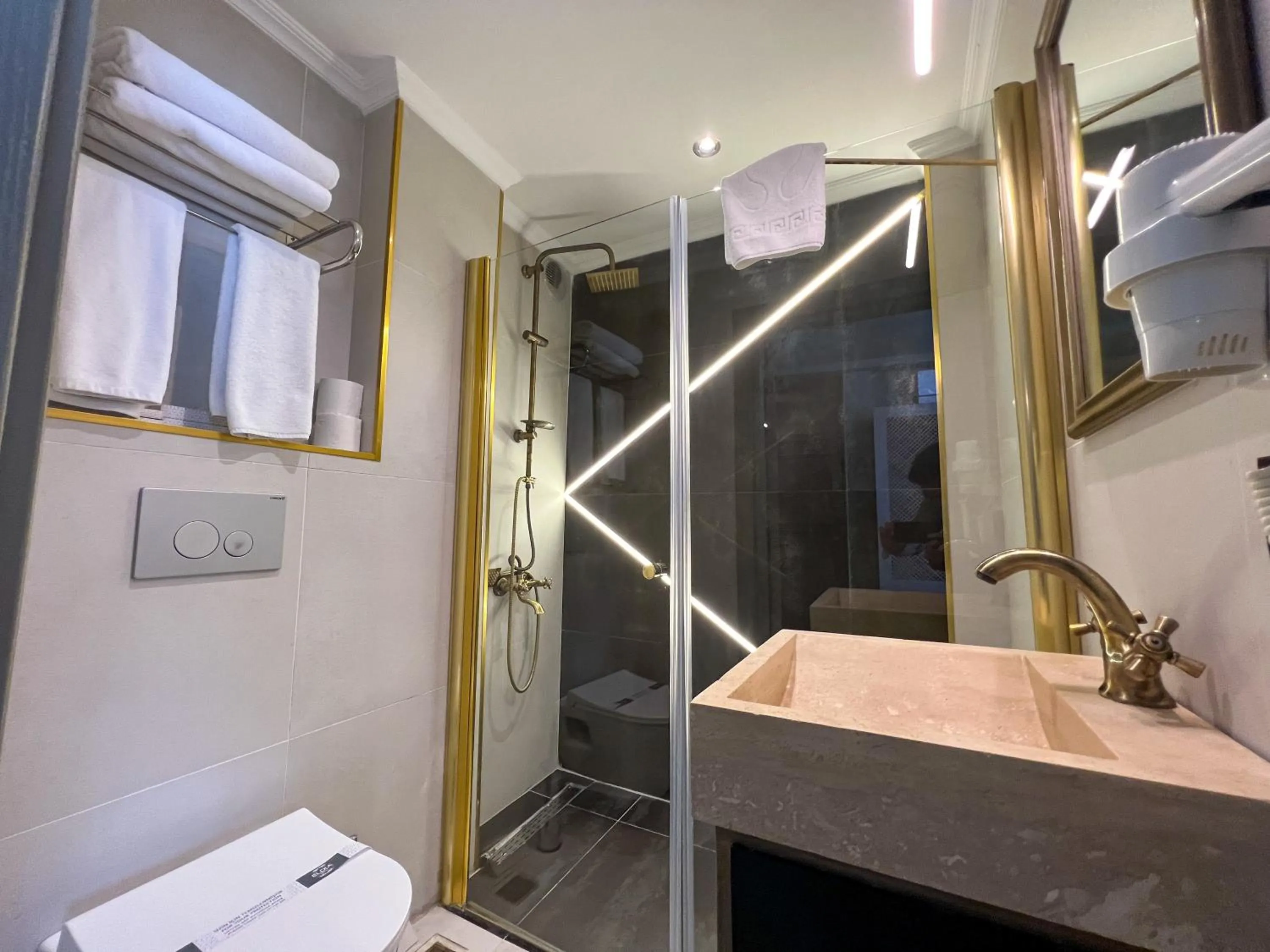 Shower in By Kinyas Hotel