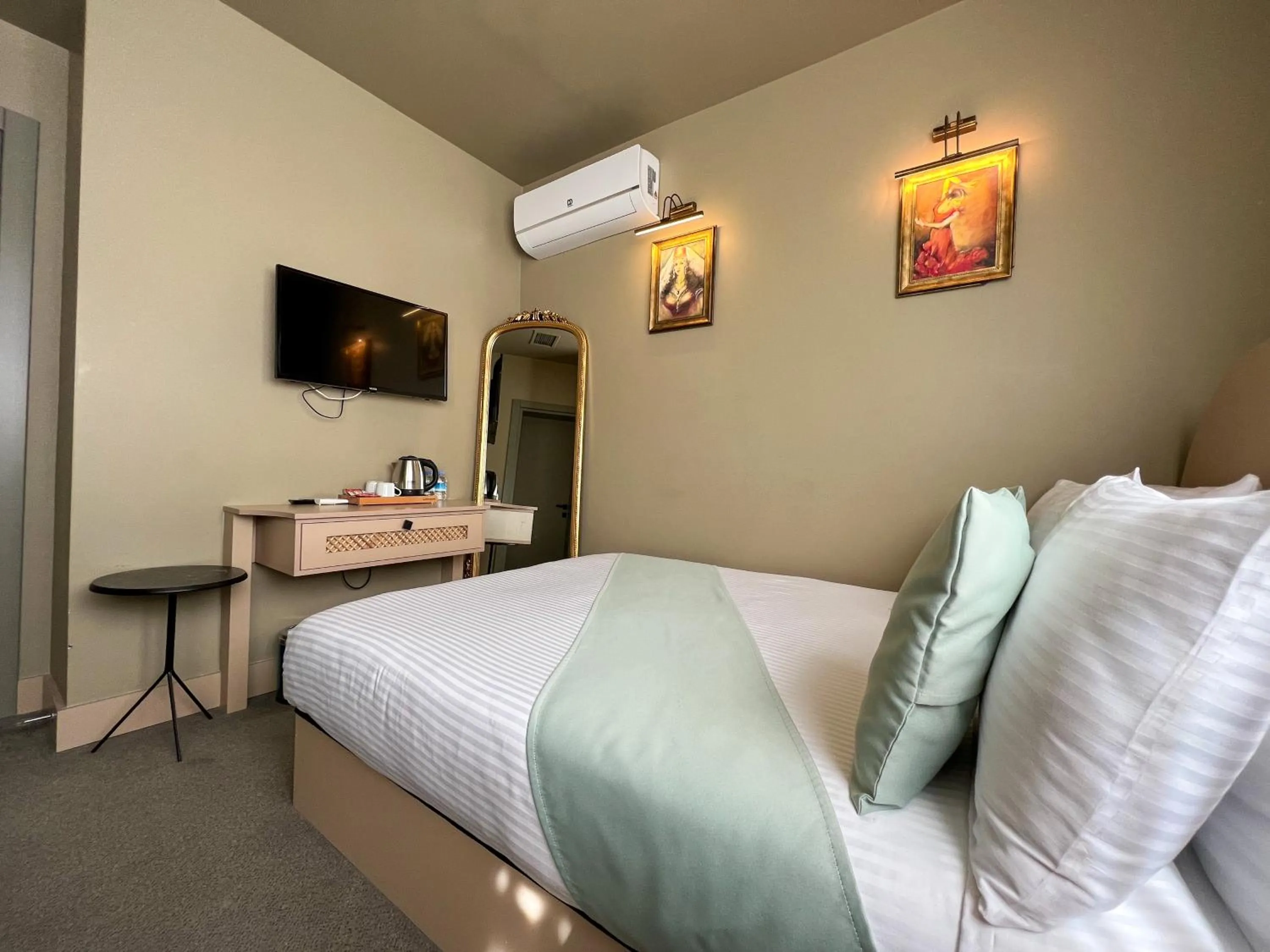 Bed in By Kinyas Hotel