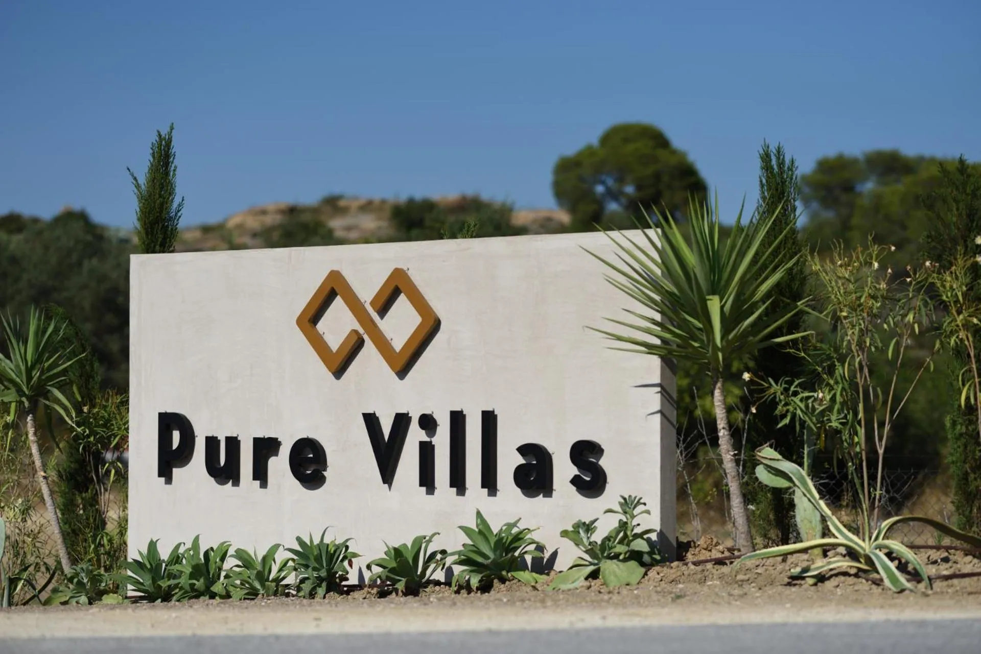 Property logo or sign in Pure Villas