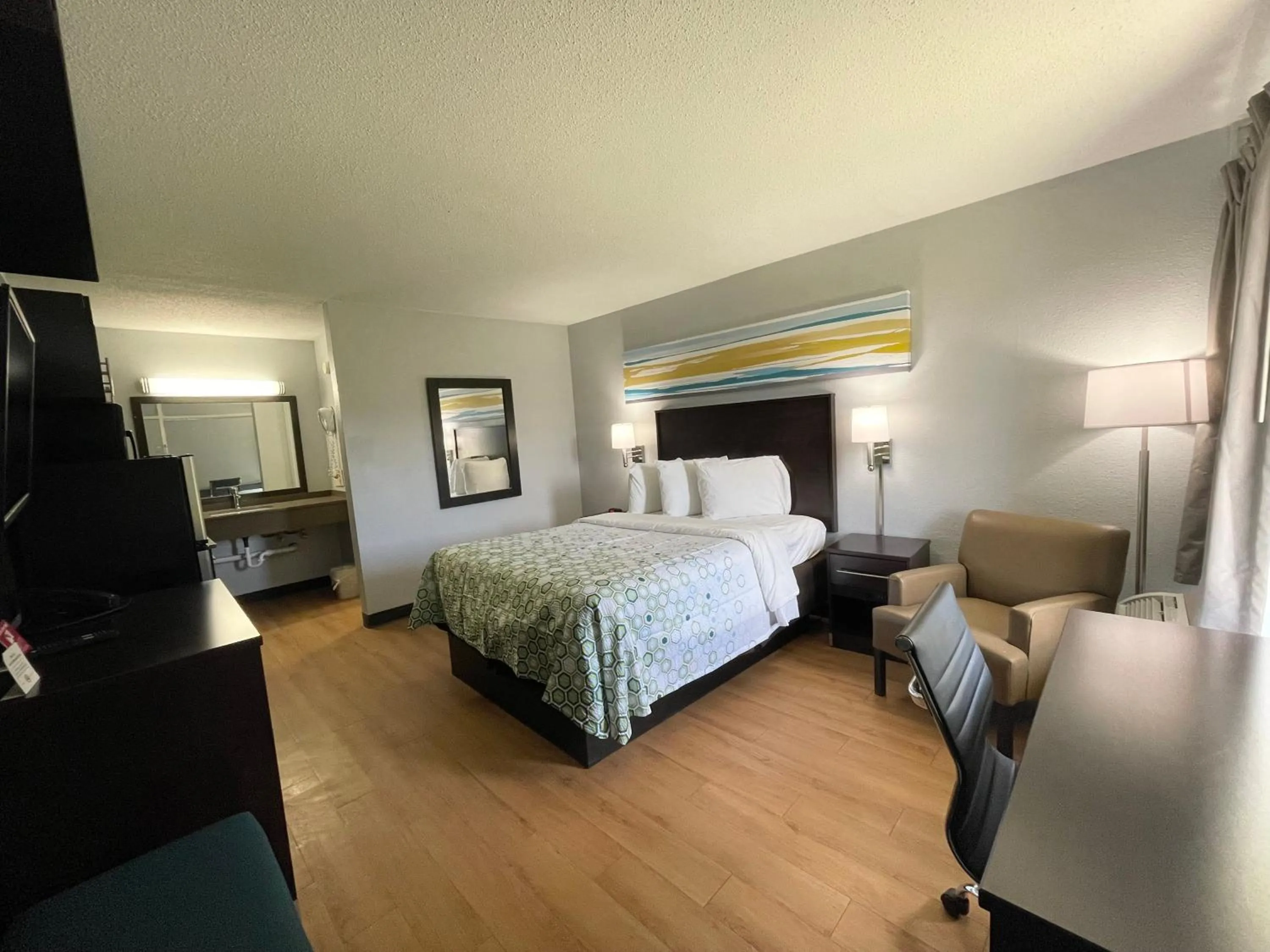 Photo of the whole room, Bed in HomeTowne Studios by Red Roof Battle Creek