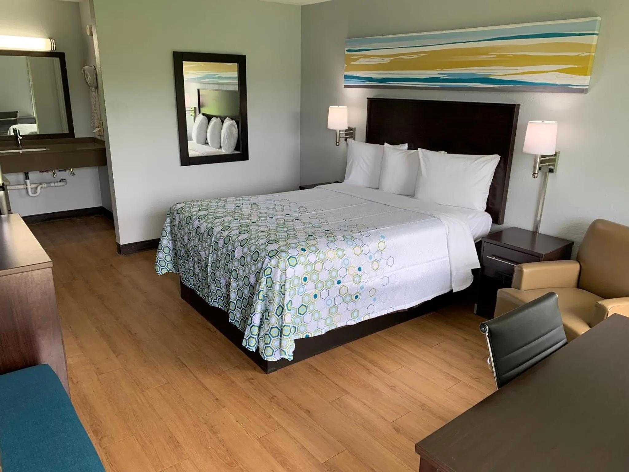 Bedroom, Bed in HomeTowne Studios by Red Roof Battle Creek