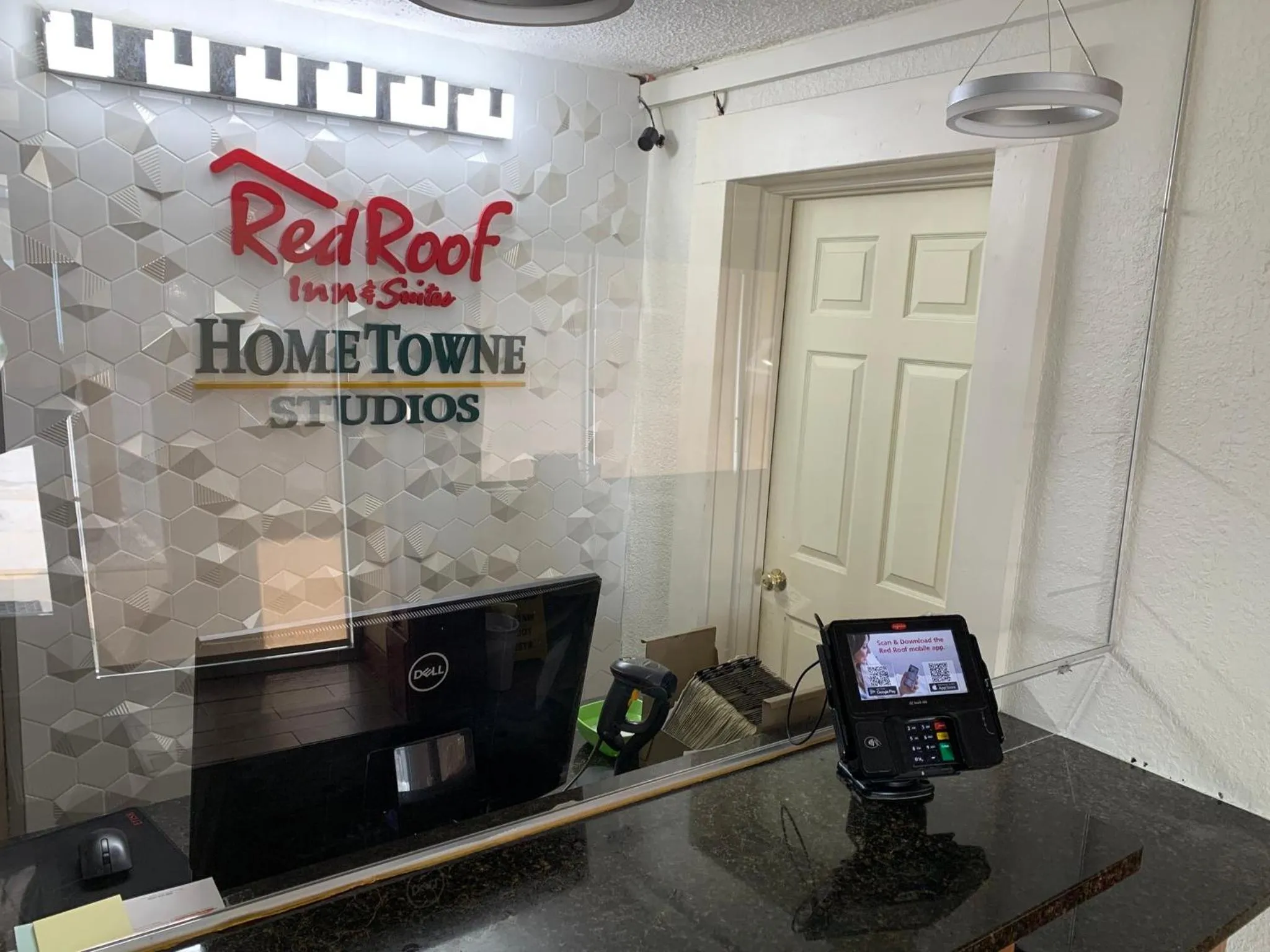 Lobby or reception in HomeTowne Studios by Red Roof Battle Creek