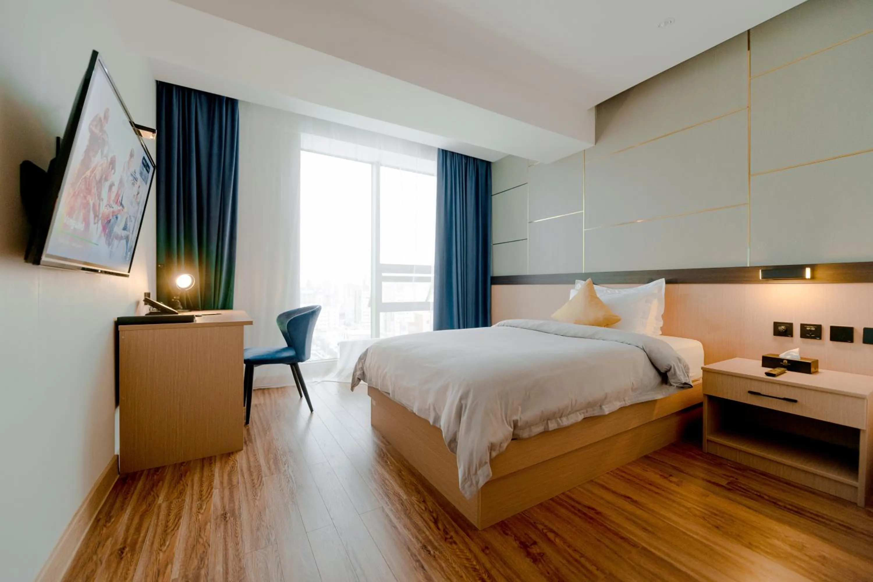 Photo of the whole room, Bed in MIllennium Plaza Hotel & Mall Ulaanbaatar