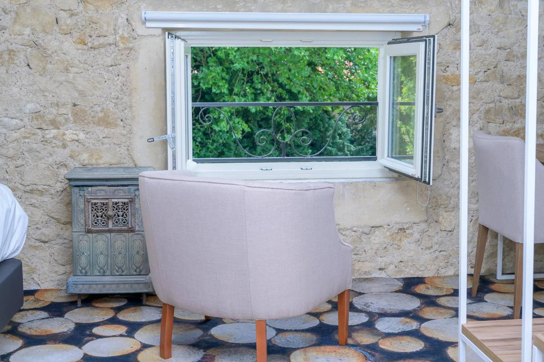 Garden view in Logis HOTEL DU PARC