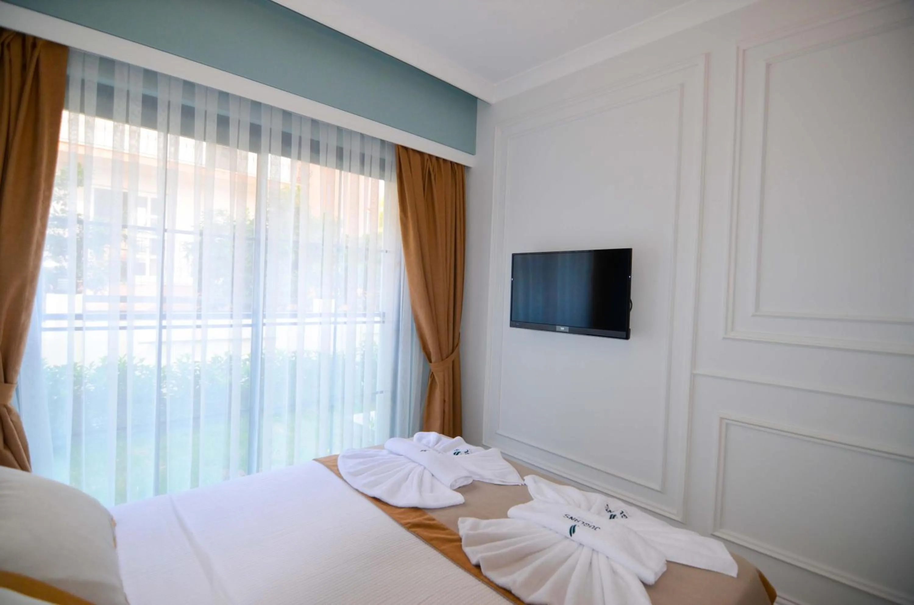 Bed in Juglans Suites