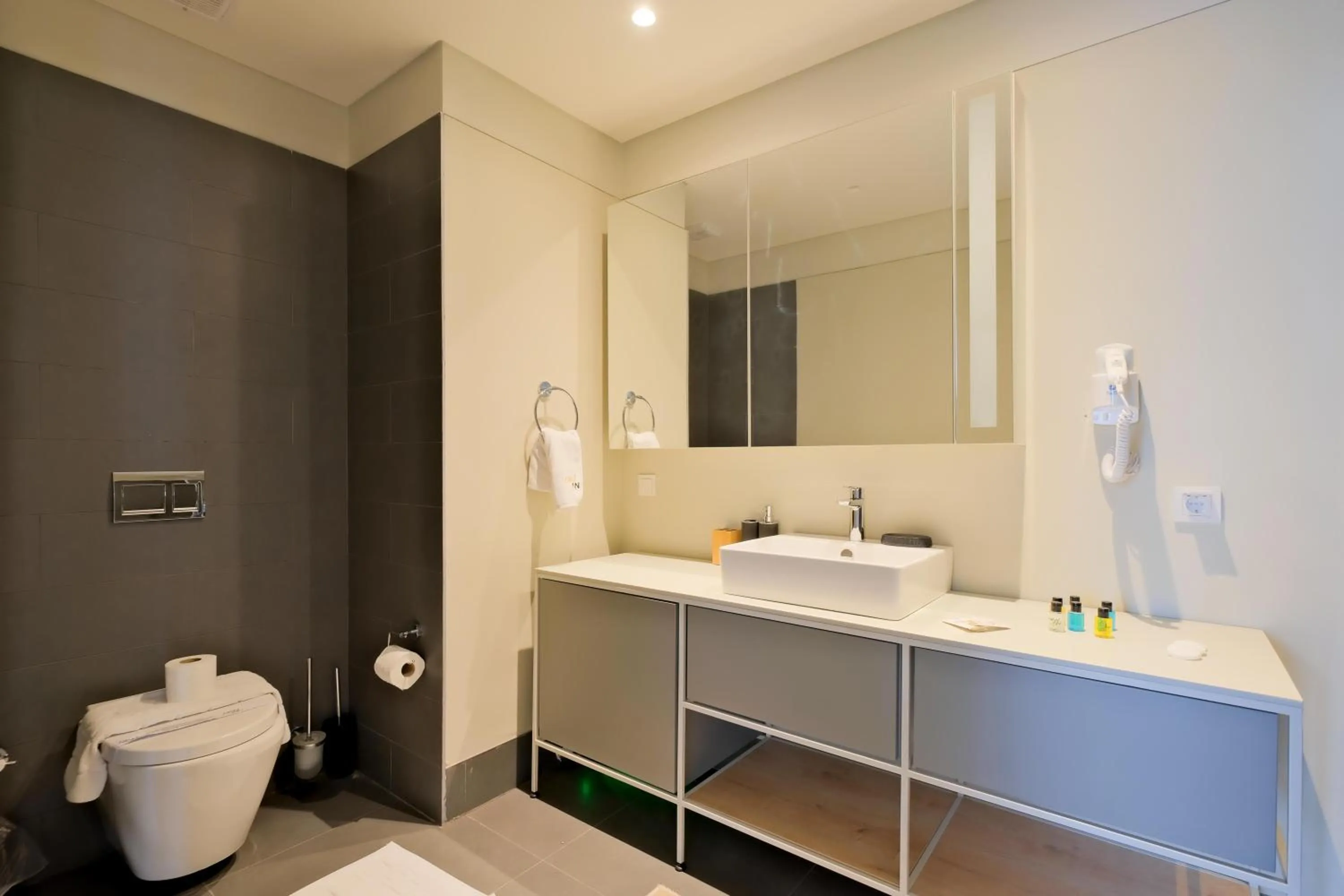 Bathroom in Roya Nova Residence by NewInn