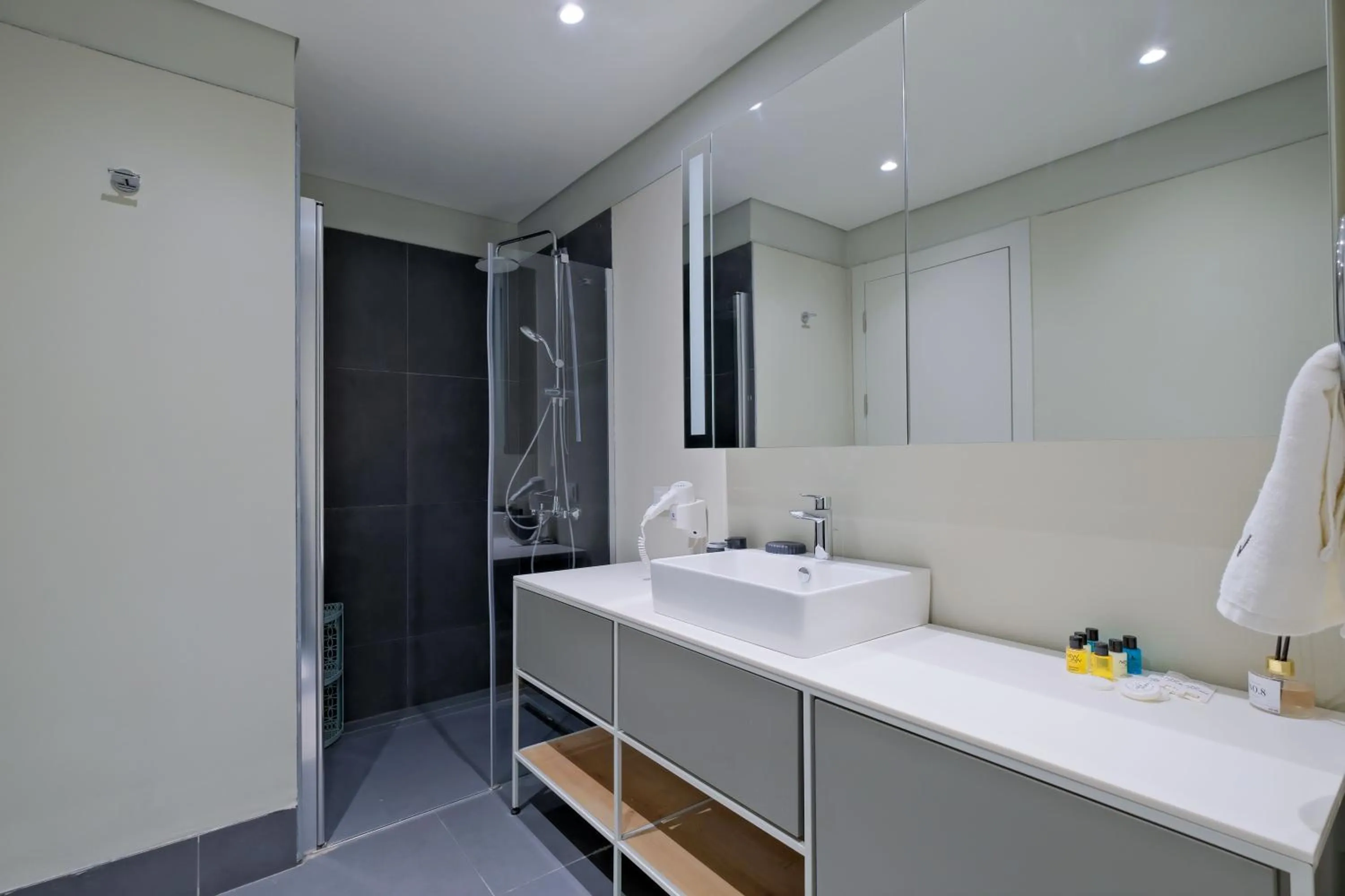 Bathroom in Roya Nova Residence by NewInn