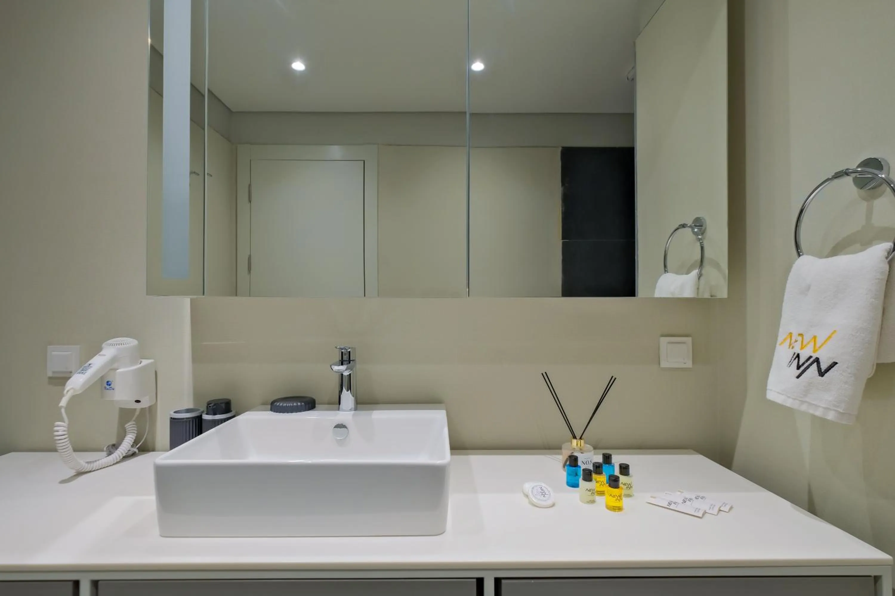 Bathroom in Roya Nova Residence by NewInn