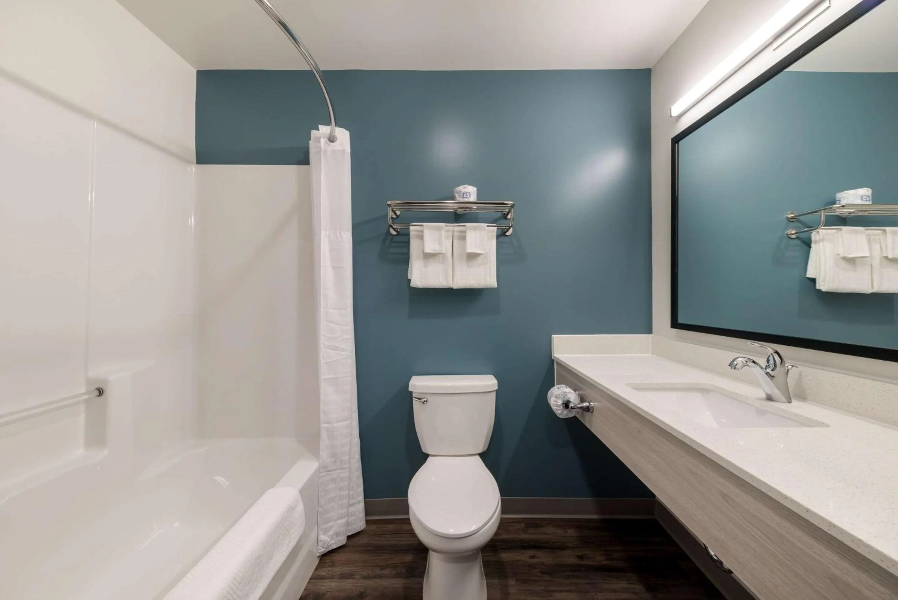 Bathroom in WoodSpring Suites Greensboro - High Point North