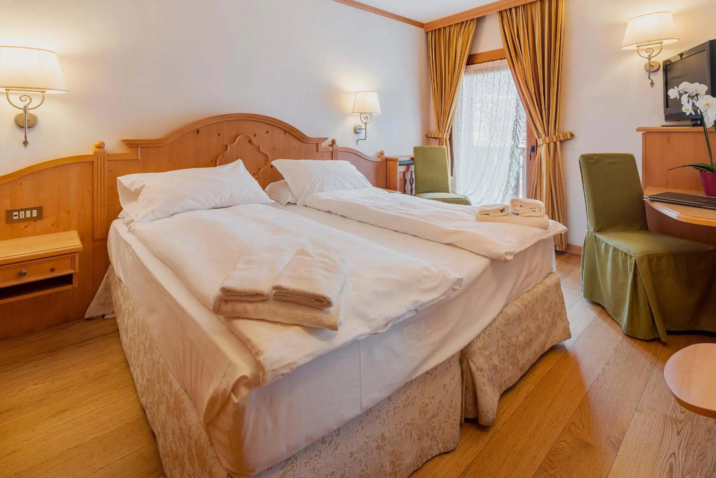 Bed in Royal Hotel Cortina