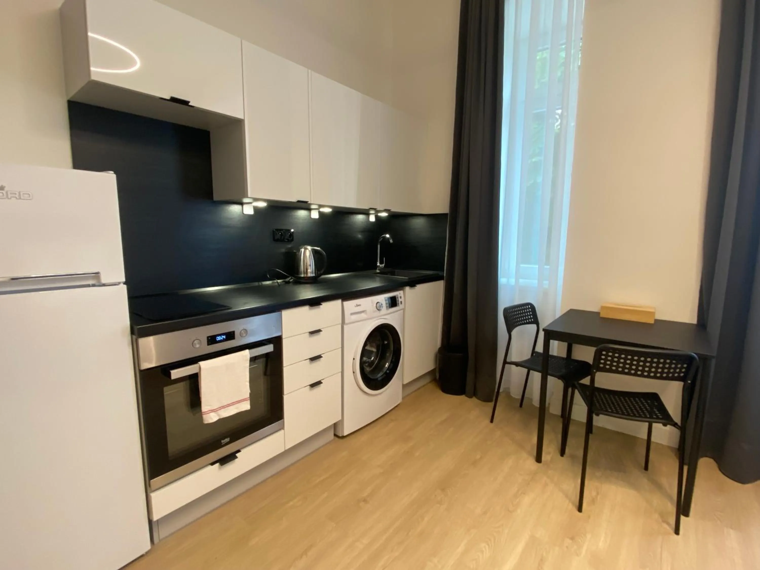 Kitchen or kitchenette in Figaro Suites