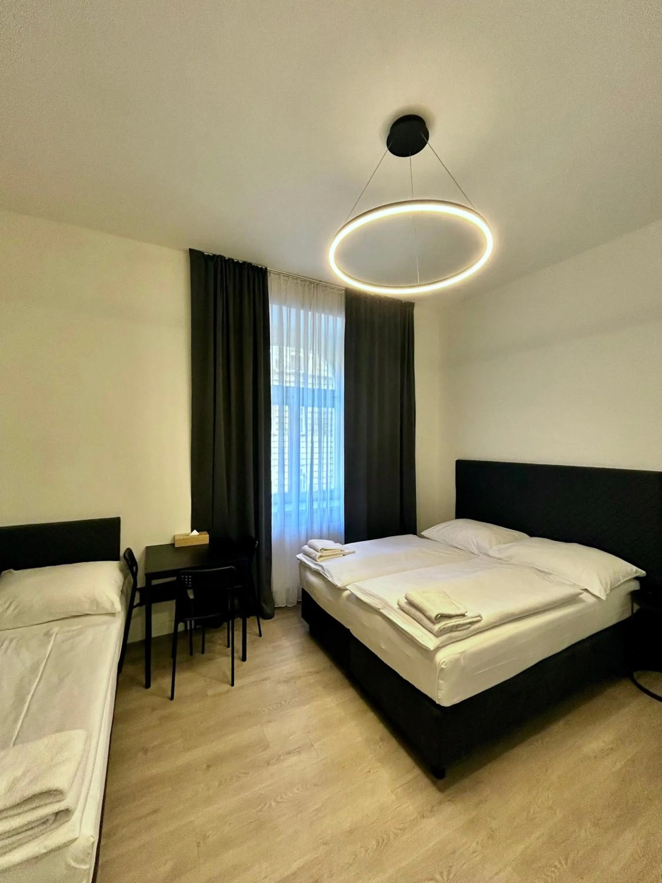 Bed in Figaro Suites