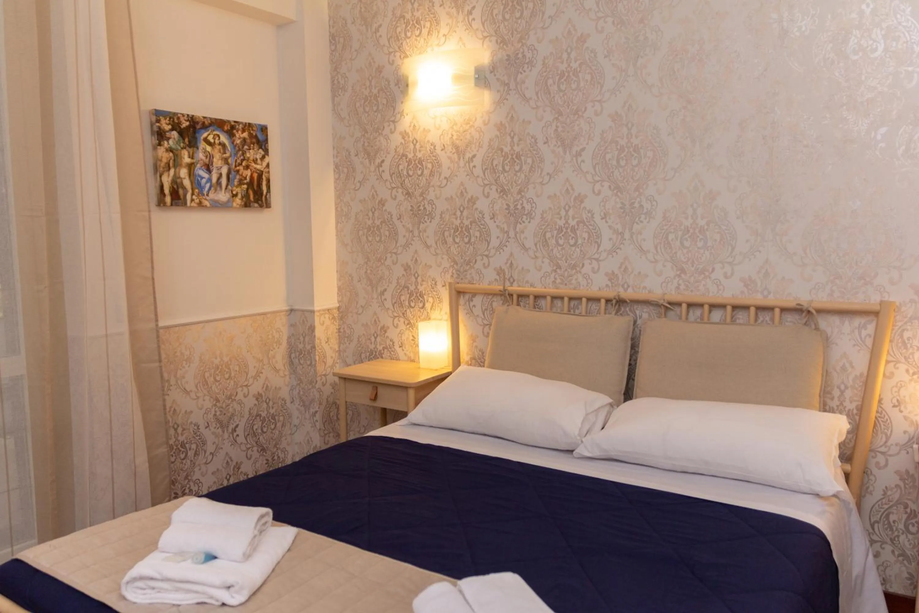 Decorative detail, Bed in Aurelio Deluxe Rooms