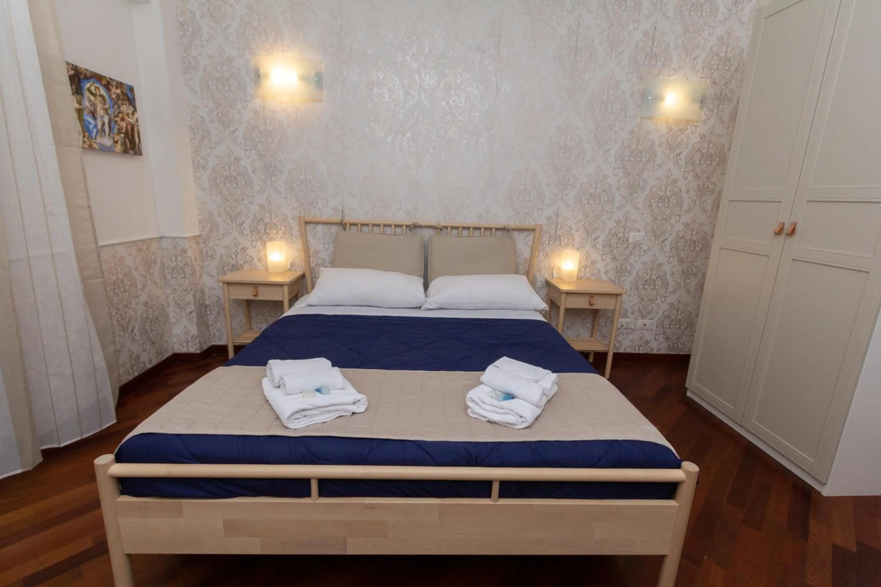 Bed in Aurelio Deluxe Rooms