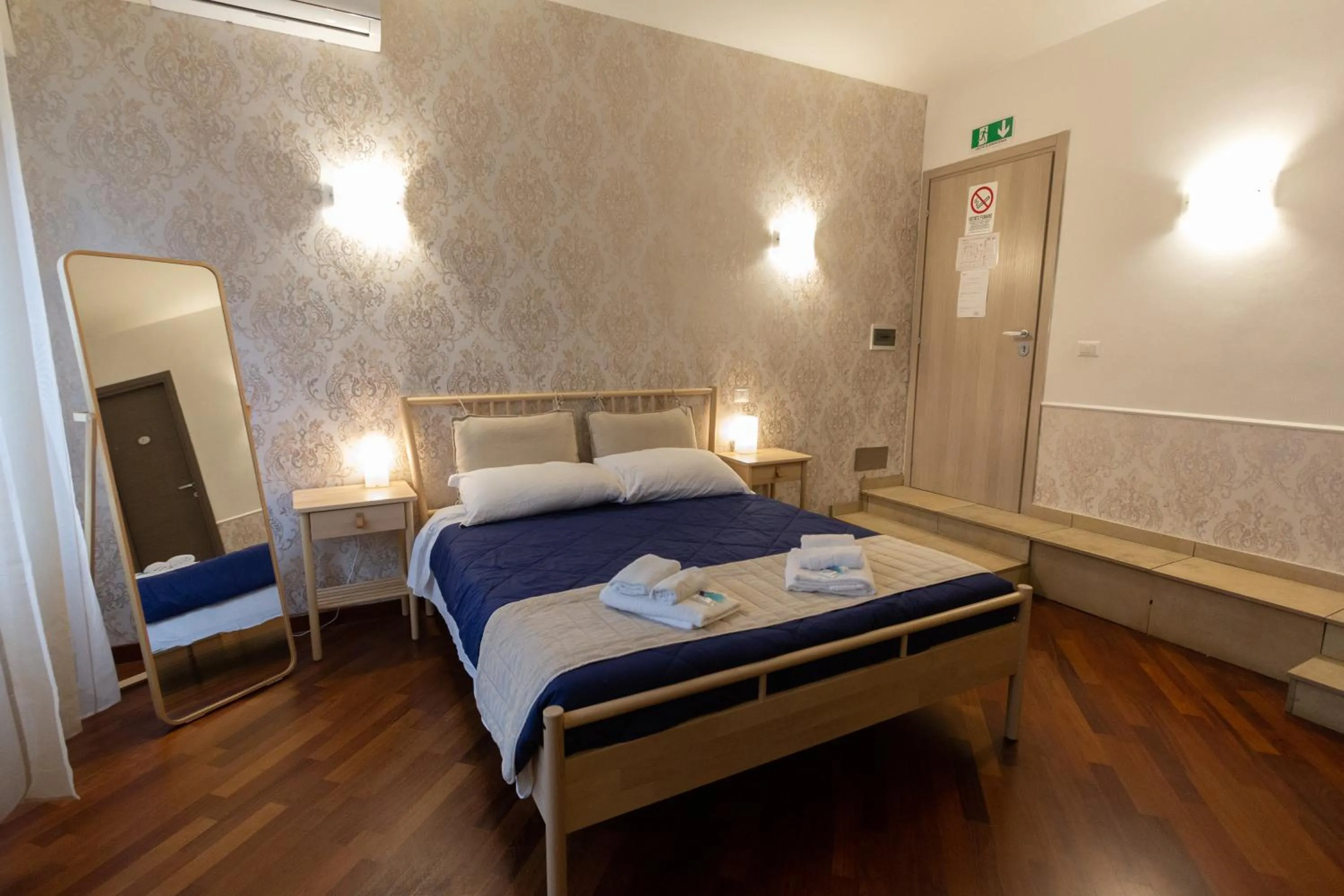 Bed in Aurelio Deluxe Rooms