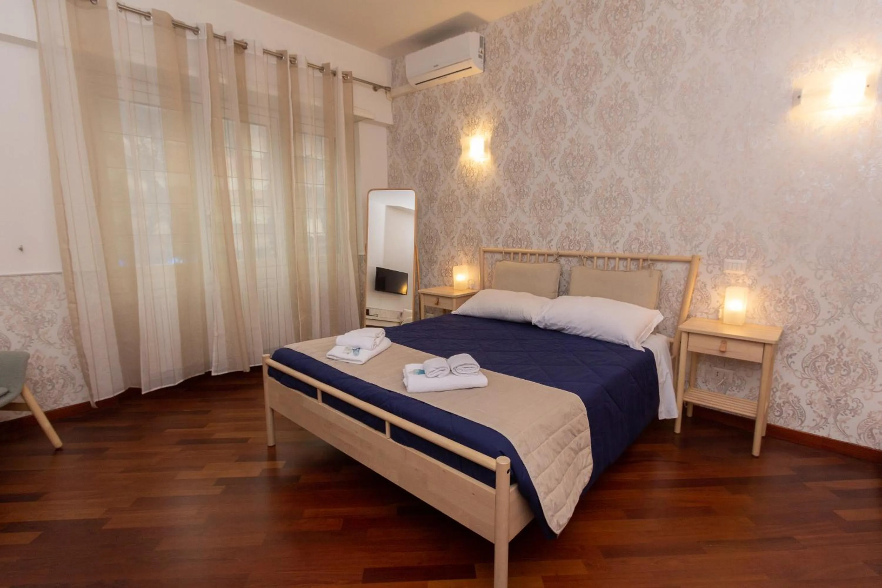 Bed in Aurelio Deluxe Rooms