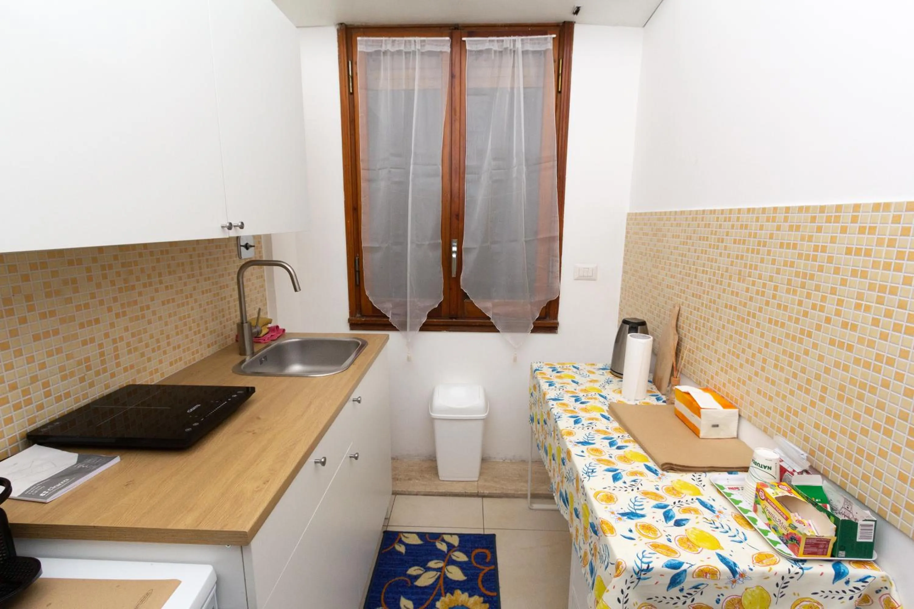 Kitchen or kitchenette in Aurelio Deluxe Rooms