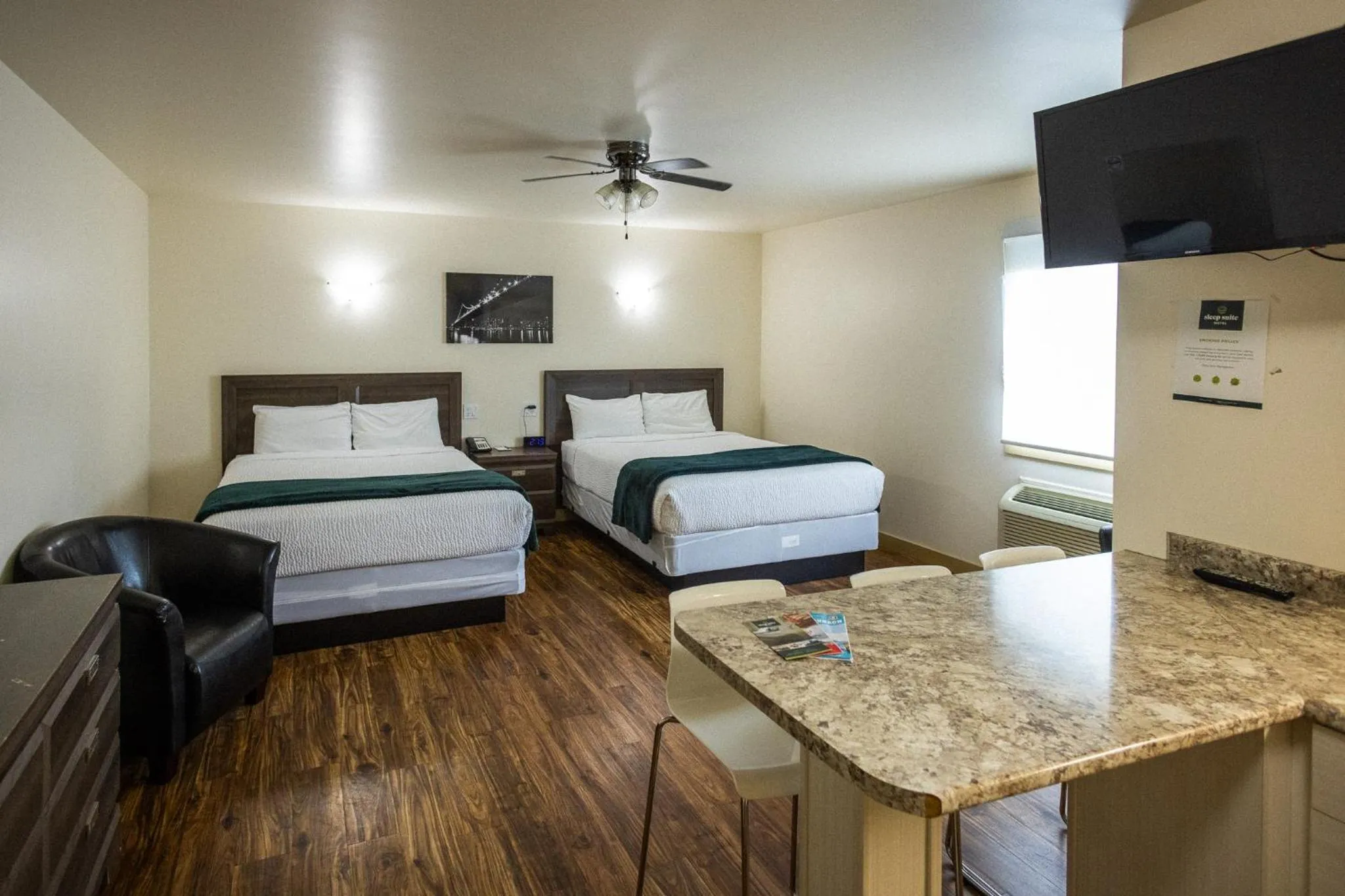 Bed in Sleep Suite Motel