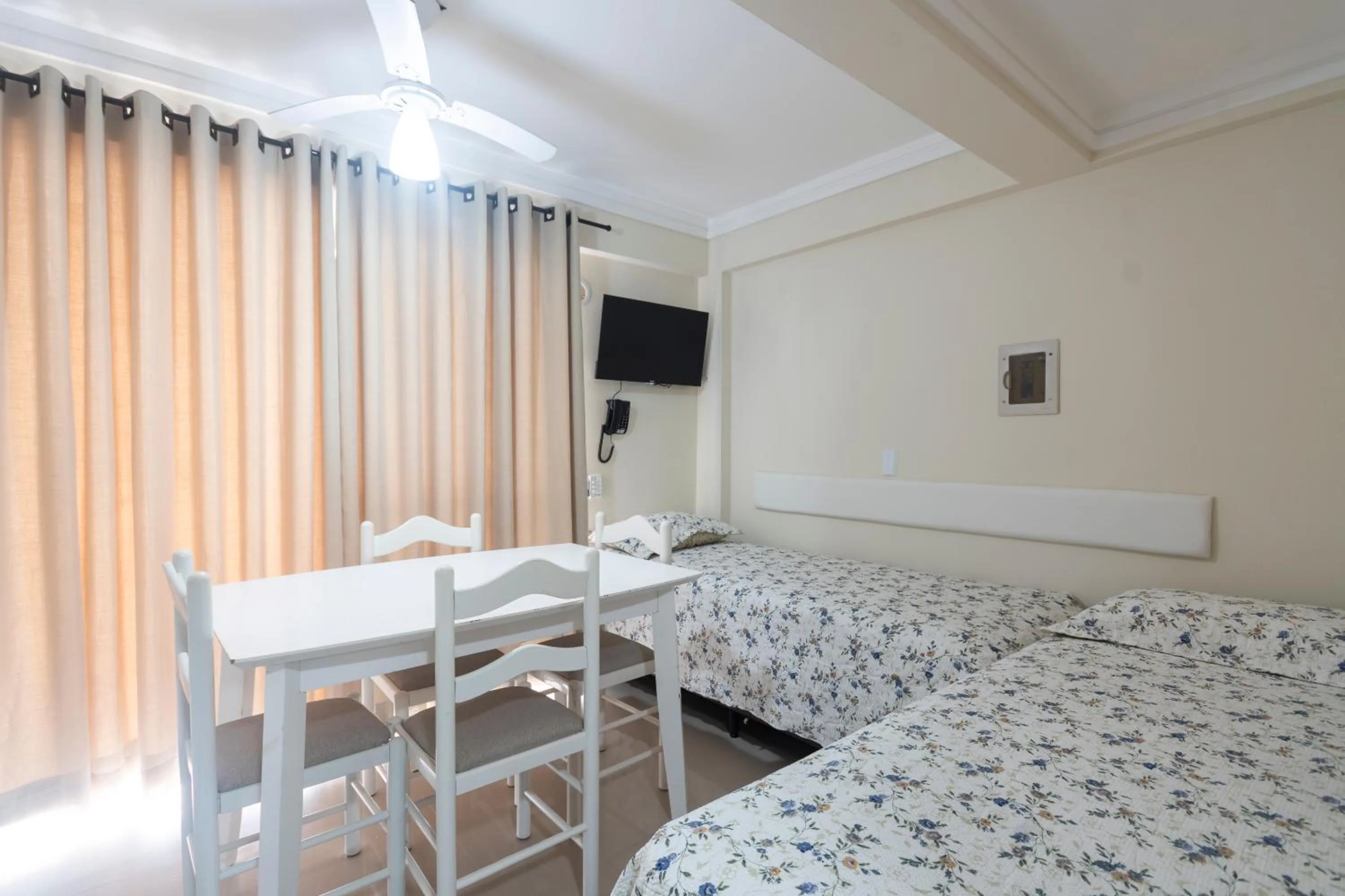 Bed in Bombinhas Tourist Apart